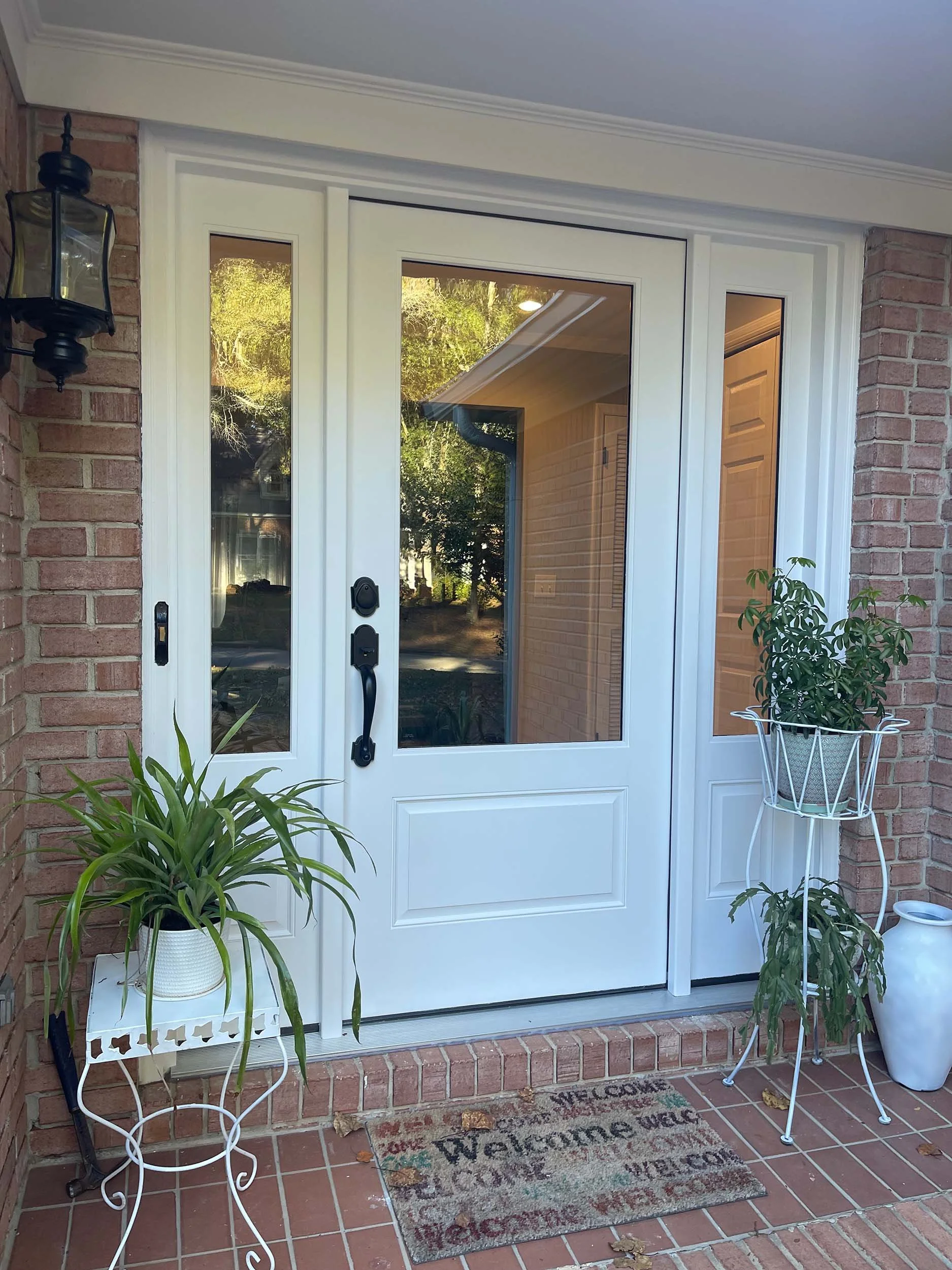 Replacement door installed to refresh the front entry of the home.