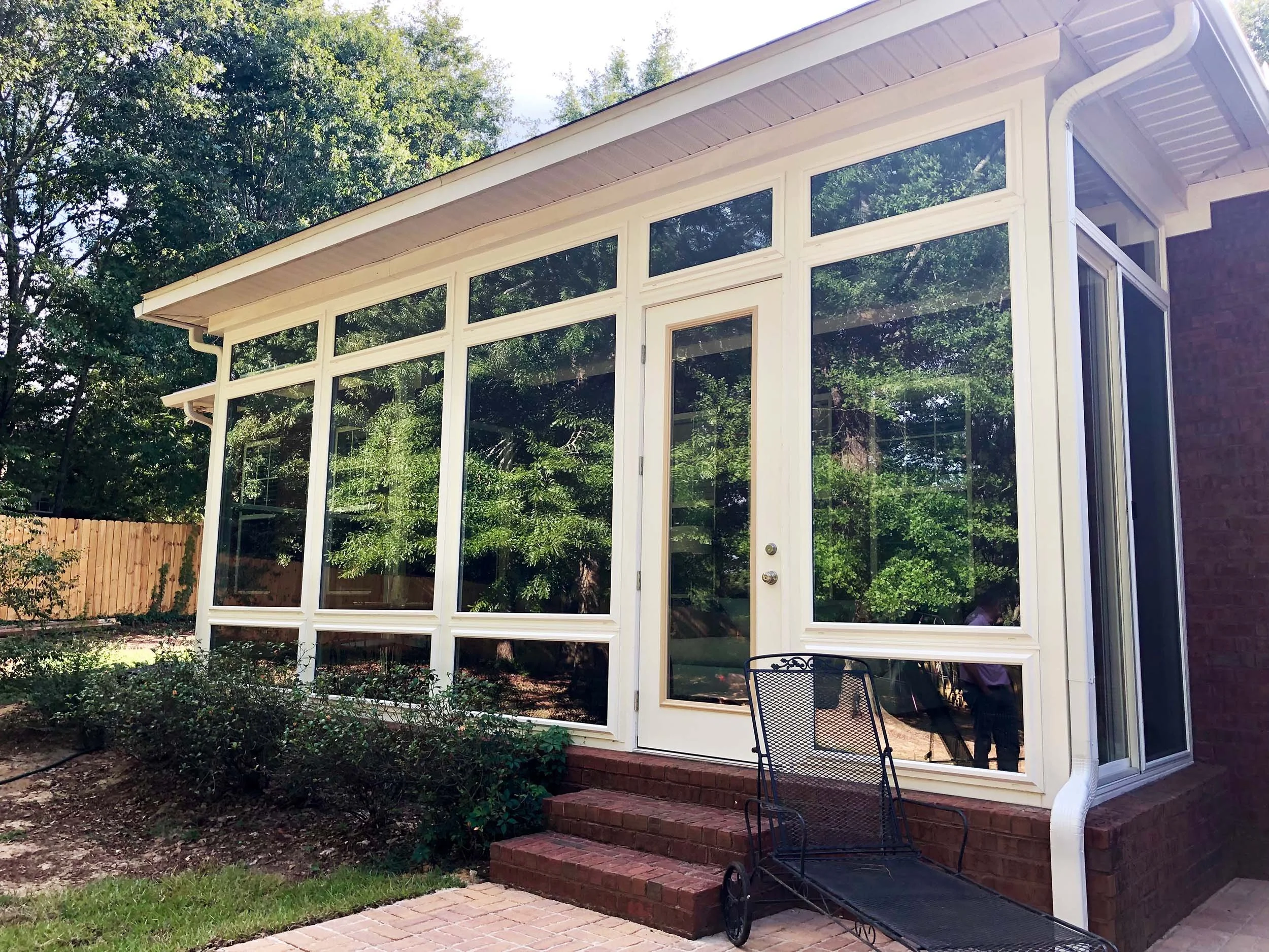 Beautiful sunroom addition with windows that bring in natural light.