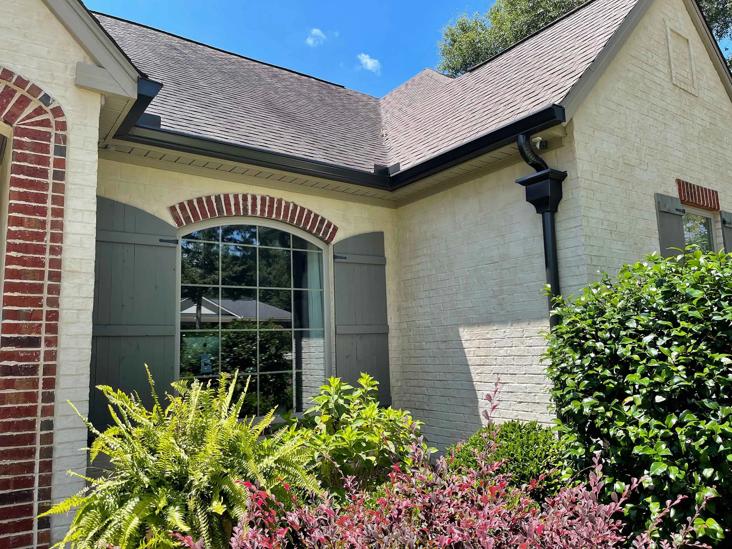Seamless gutters installed to protect outdoor areas from excess rainwater runoff.