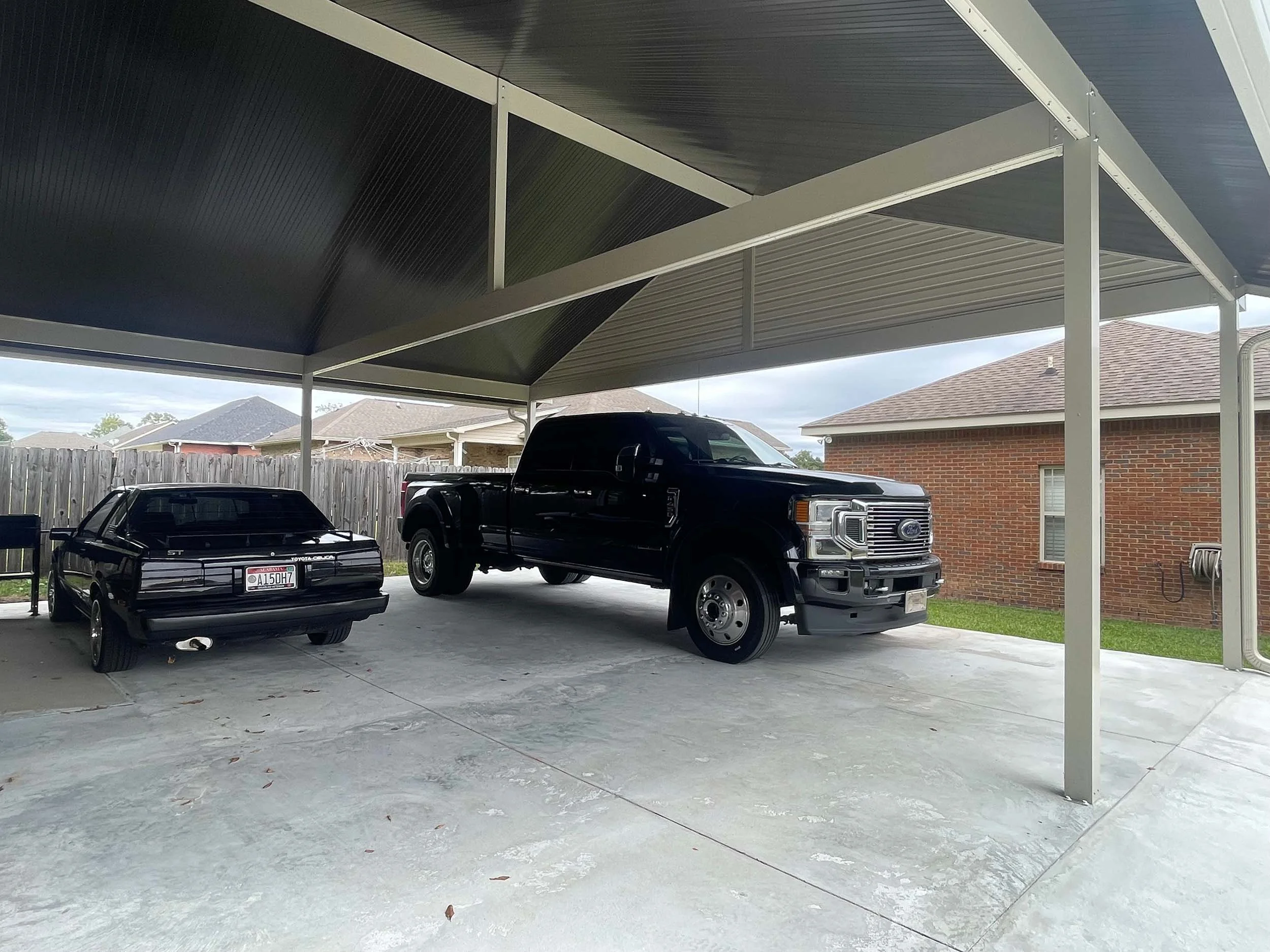 Attached carport designed for easy access and reliable vehicle protection.