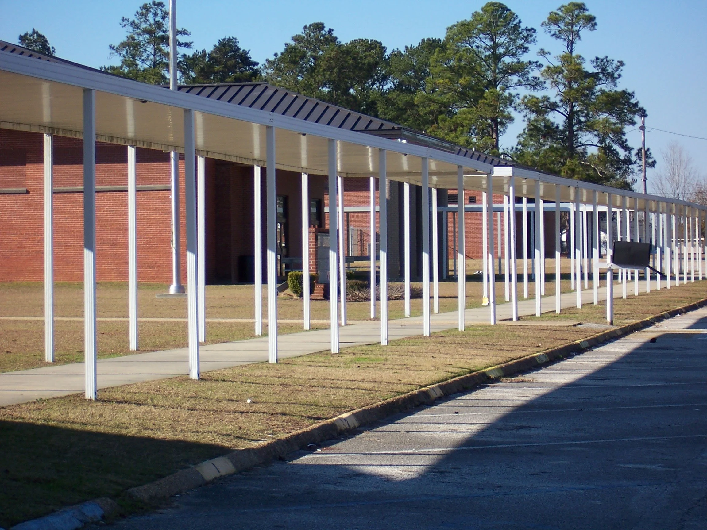 Durable commercial walkway cover designed for shade, weather protection, and accessibility.