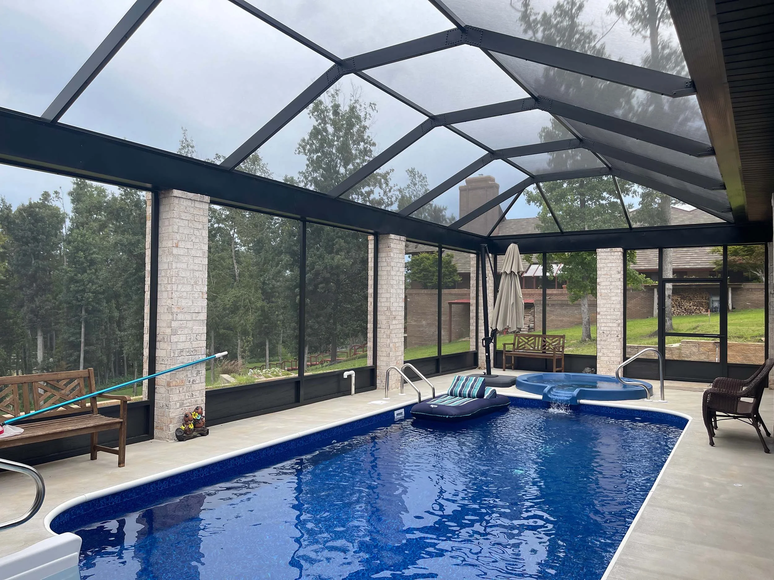 Residential pool cage designed to improve outdoor comfort and usability.