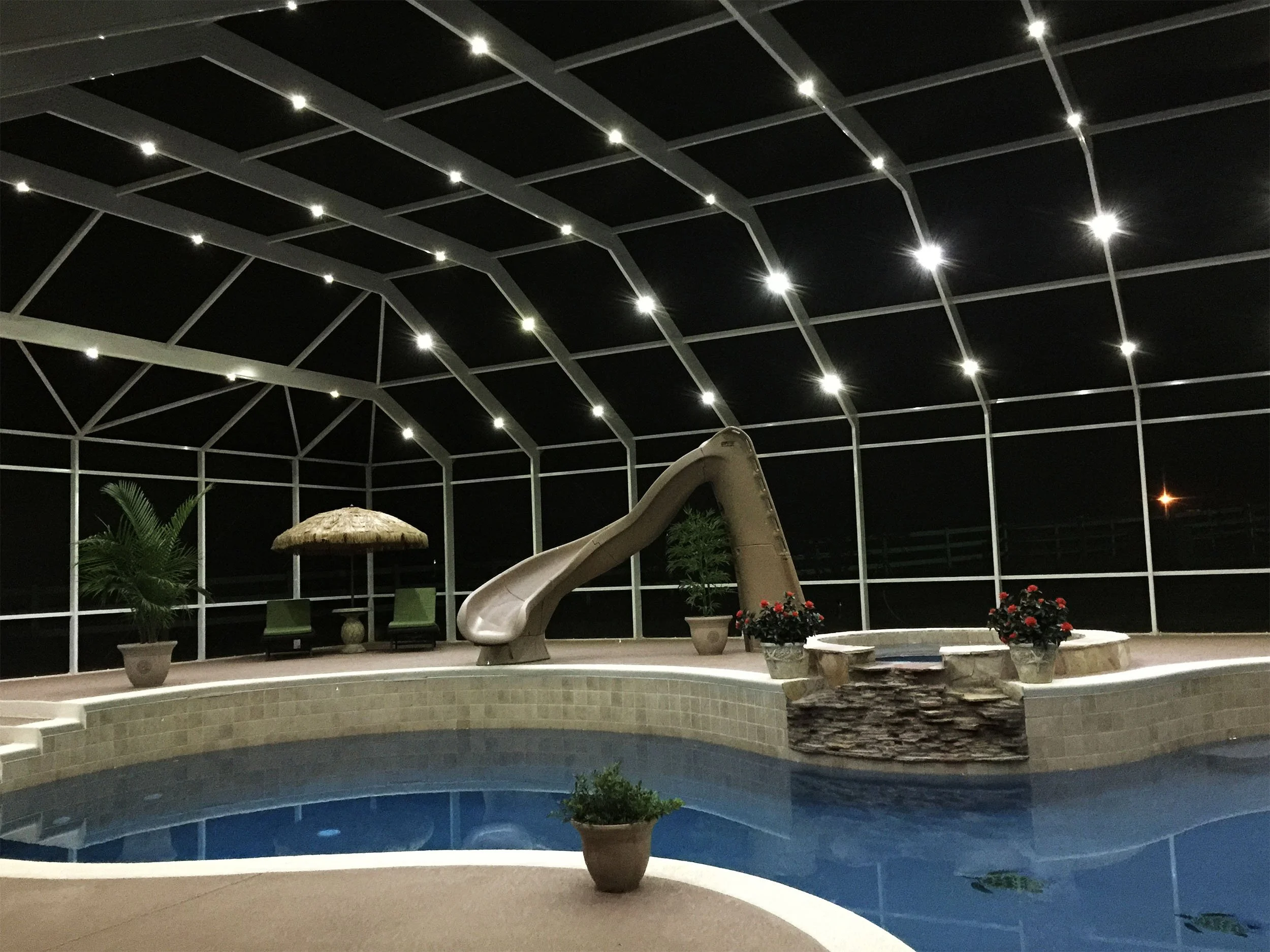 Screened pool cage built to enhance backyard comfort and reduce debris.