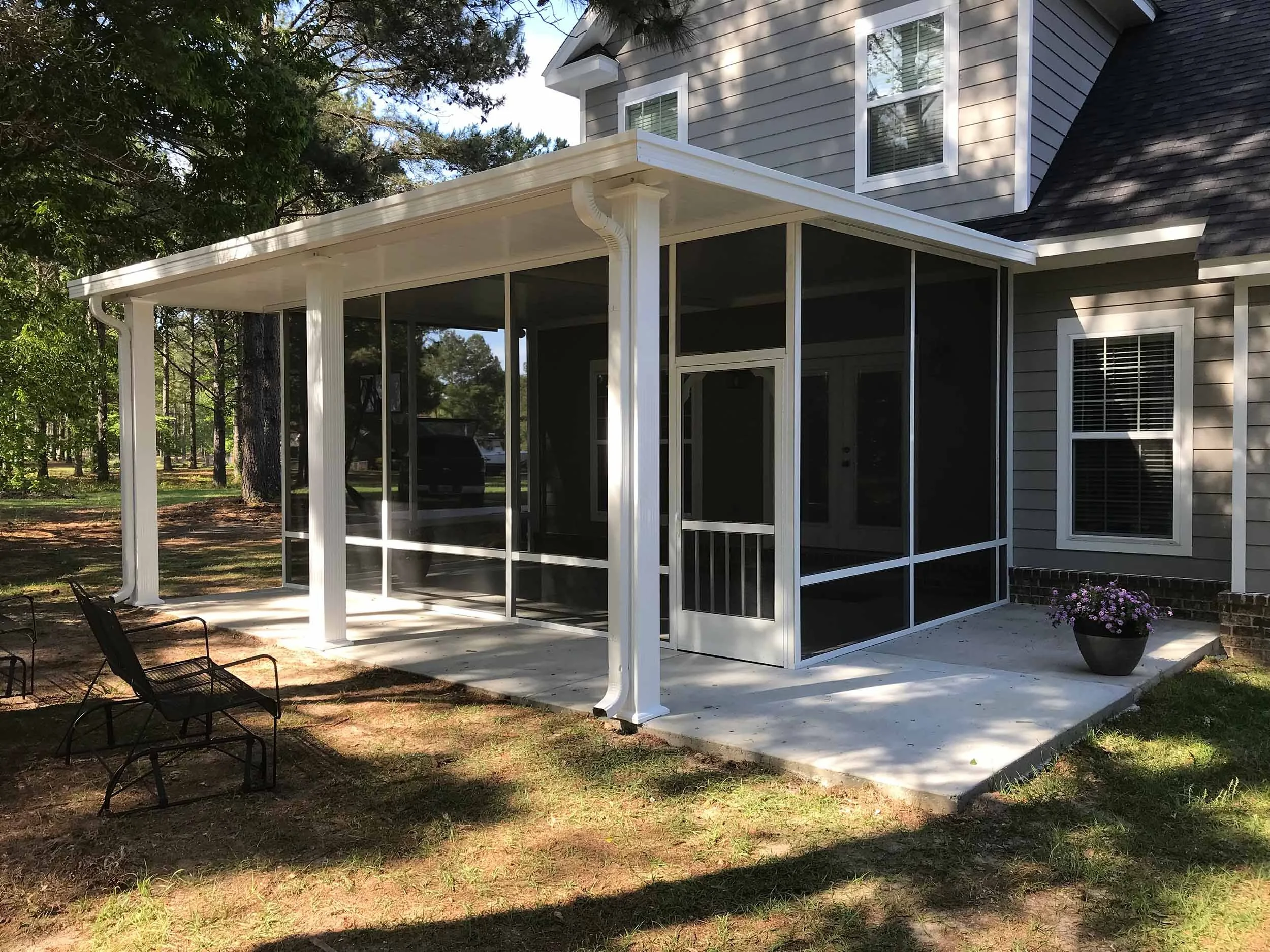 Enclosed screenroom addition creating a relaxing space for everyday use.