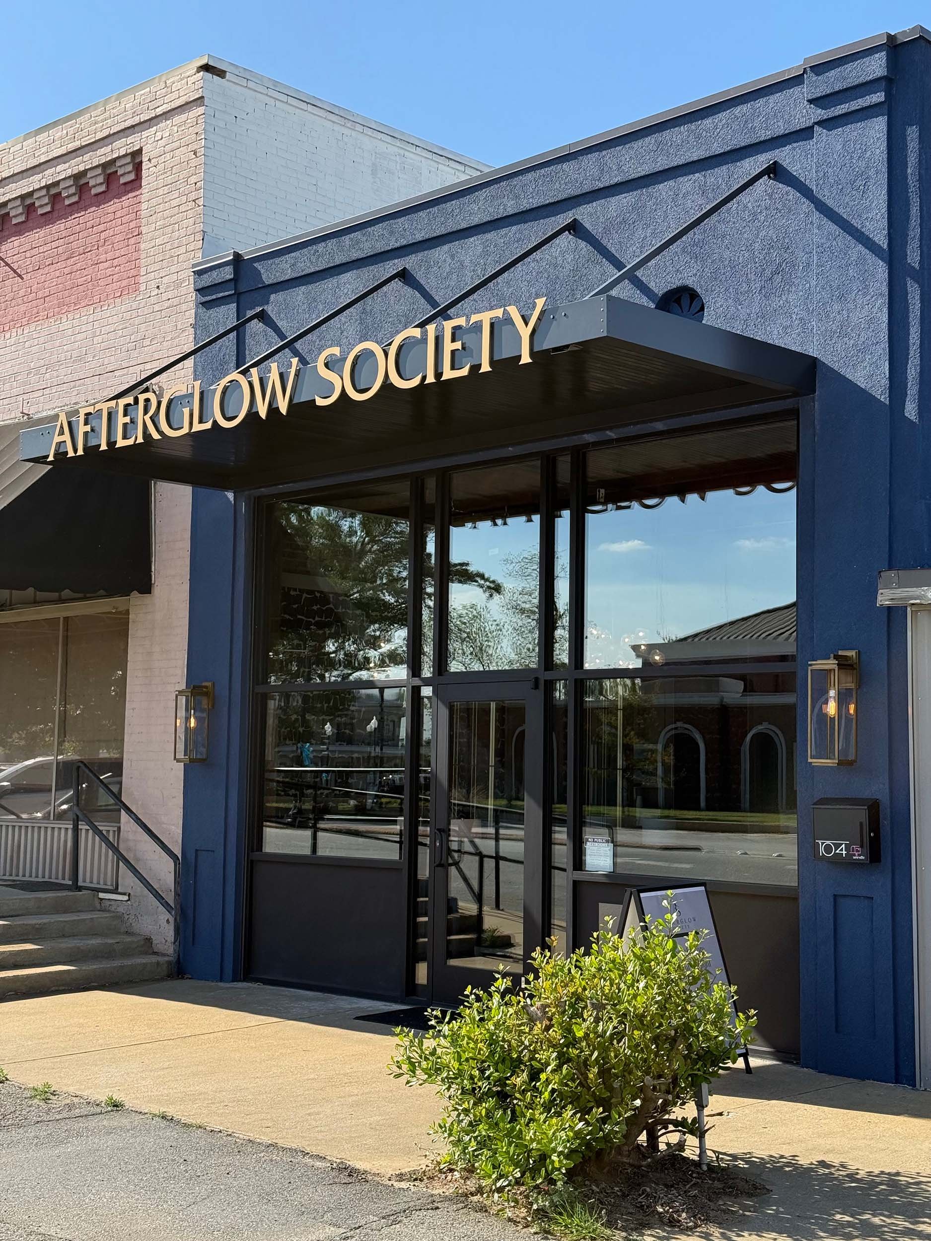Storefront awning installation for a more polished and inviting business entrance.