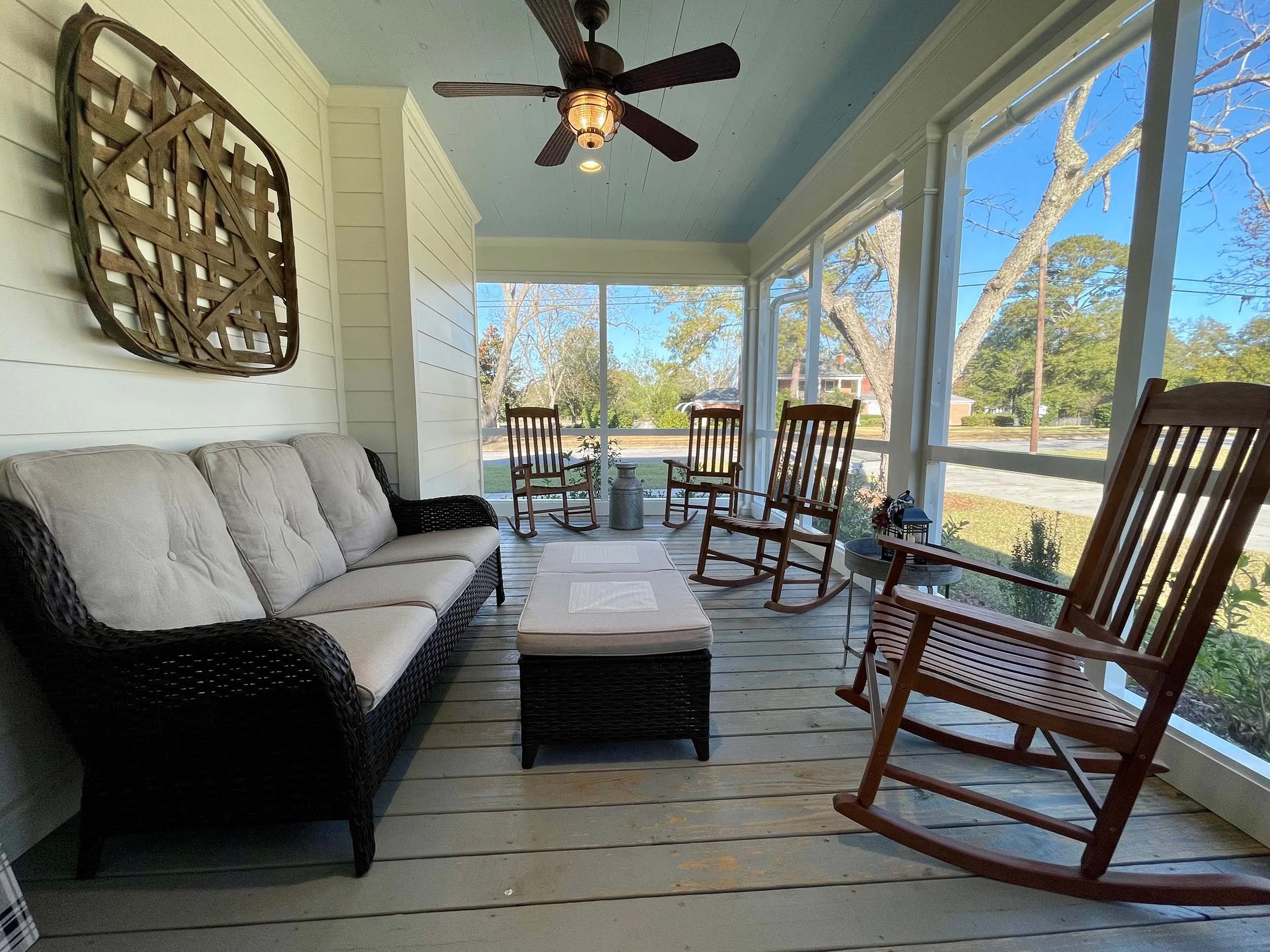 Screened enclosure designed to make a patio more usable and protected.
