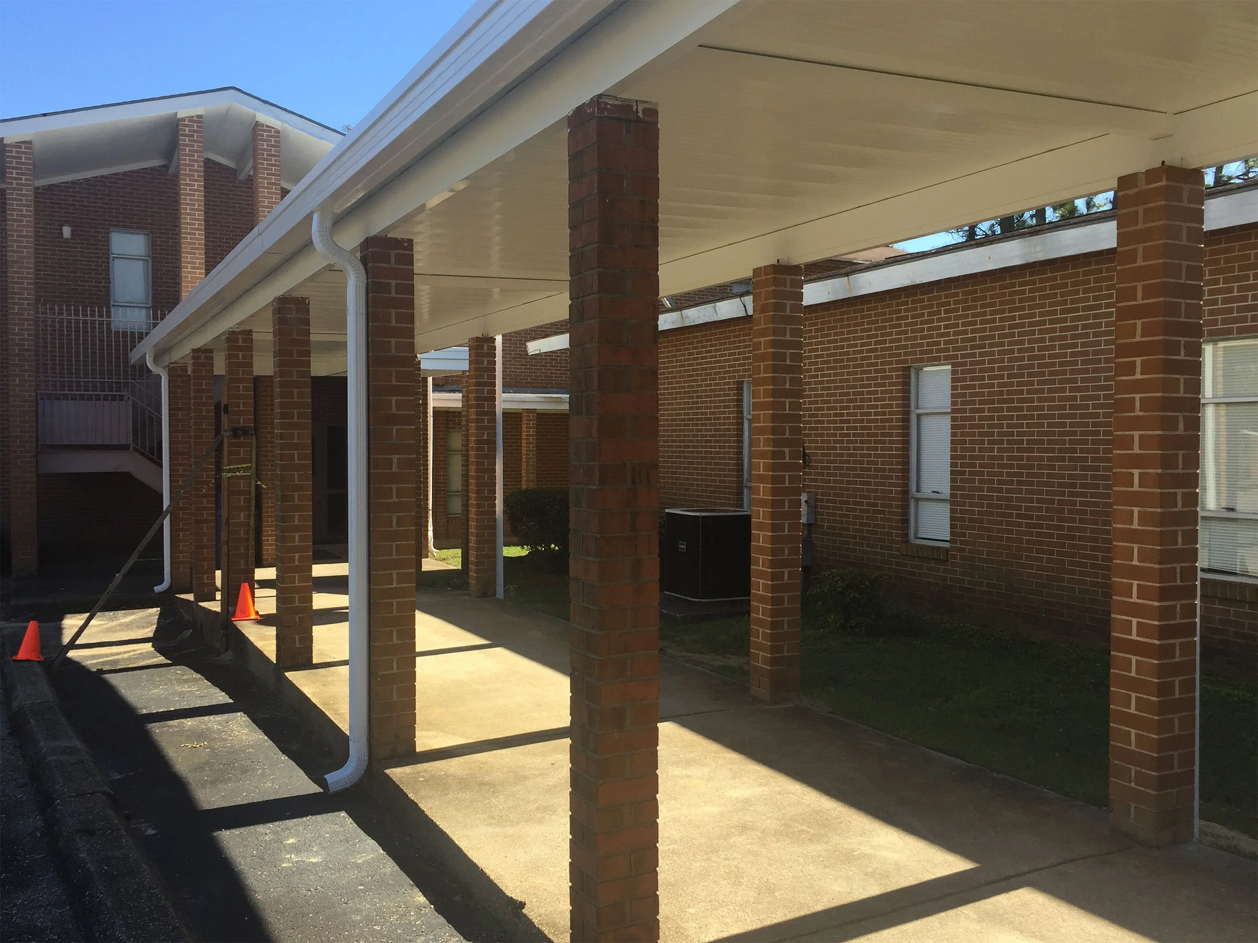 Commercial covered walkway installation for improved safety and everyday function.