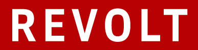 Red and white sign with the word 'REVOLT' in bold uppercase letters.
