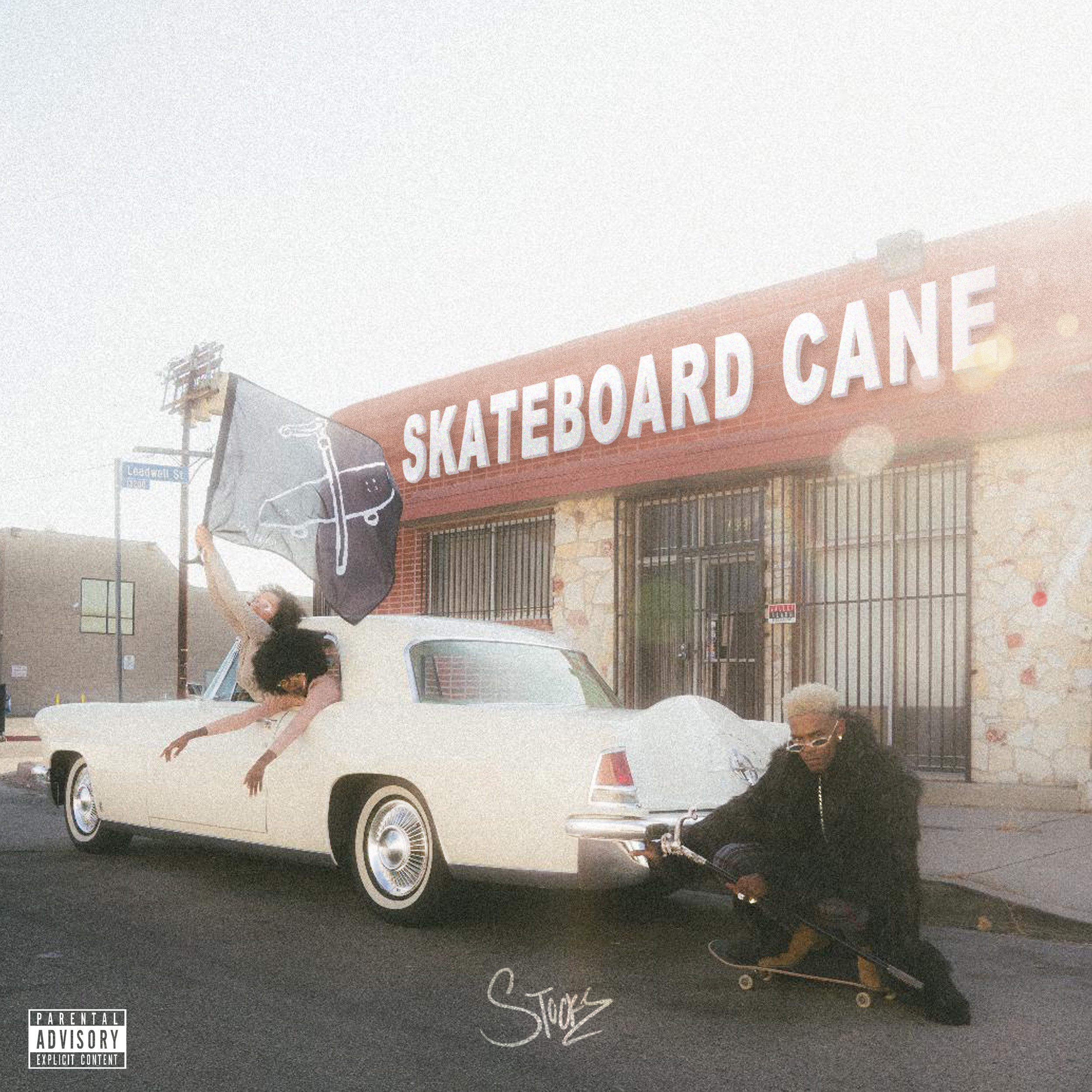 skateboard cane album cover stockz on skateboard with women hanging out of classic car in front of skate shop