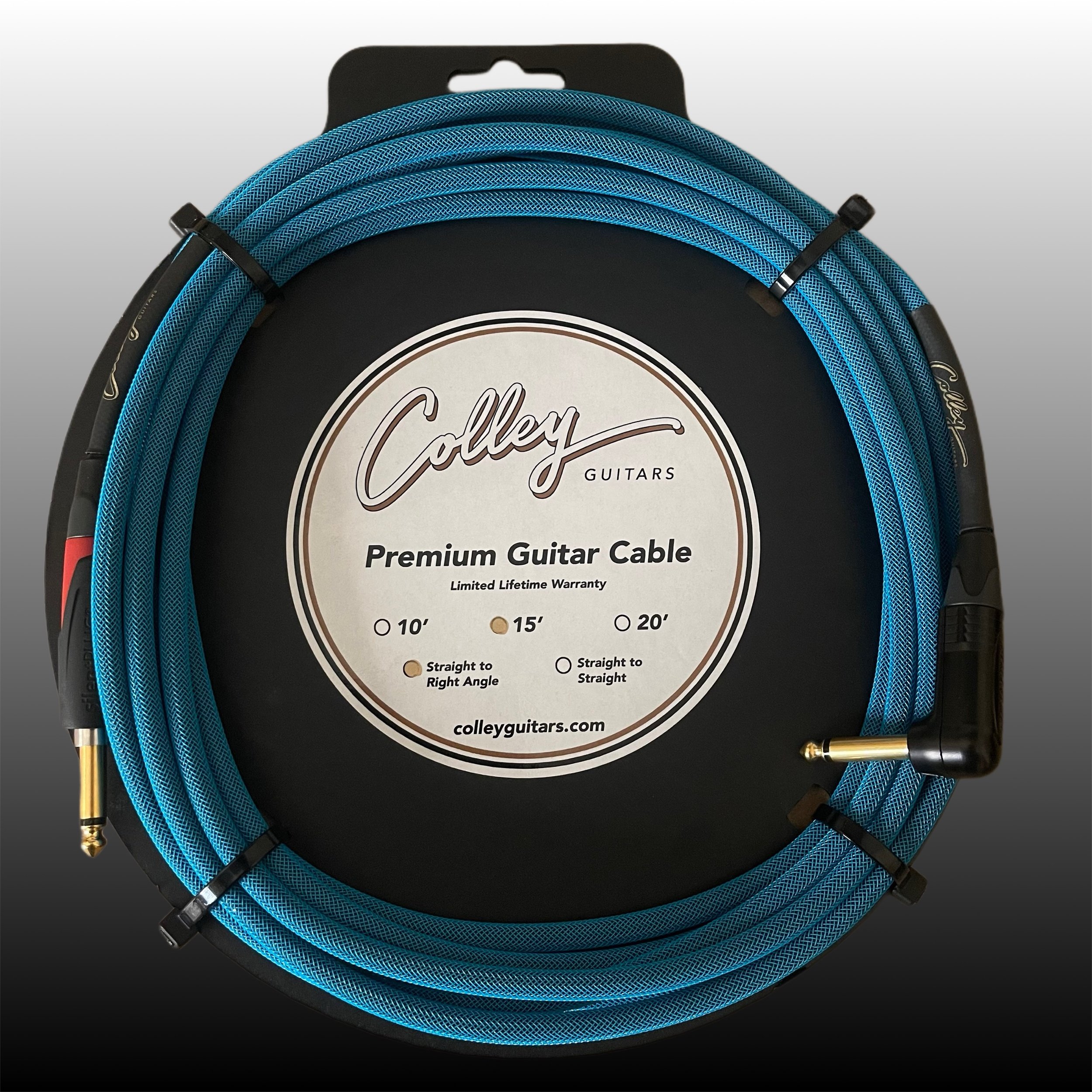 Blue guitar cable coiled on a black circular display with label reading 'Colley Guitars Premium Guitar Cable, Limited Lifetime Warranty, options for 10, 15, or 20 feet, straight or right angle connector, website colleyguitars.com.