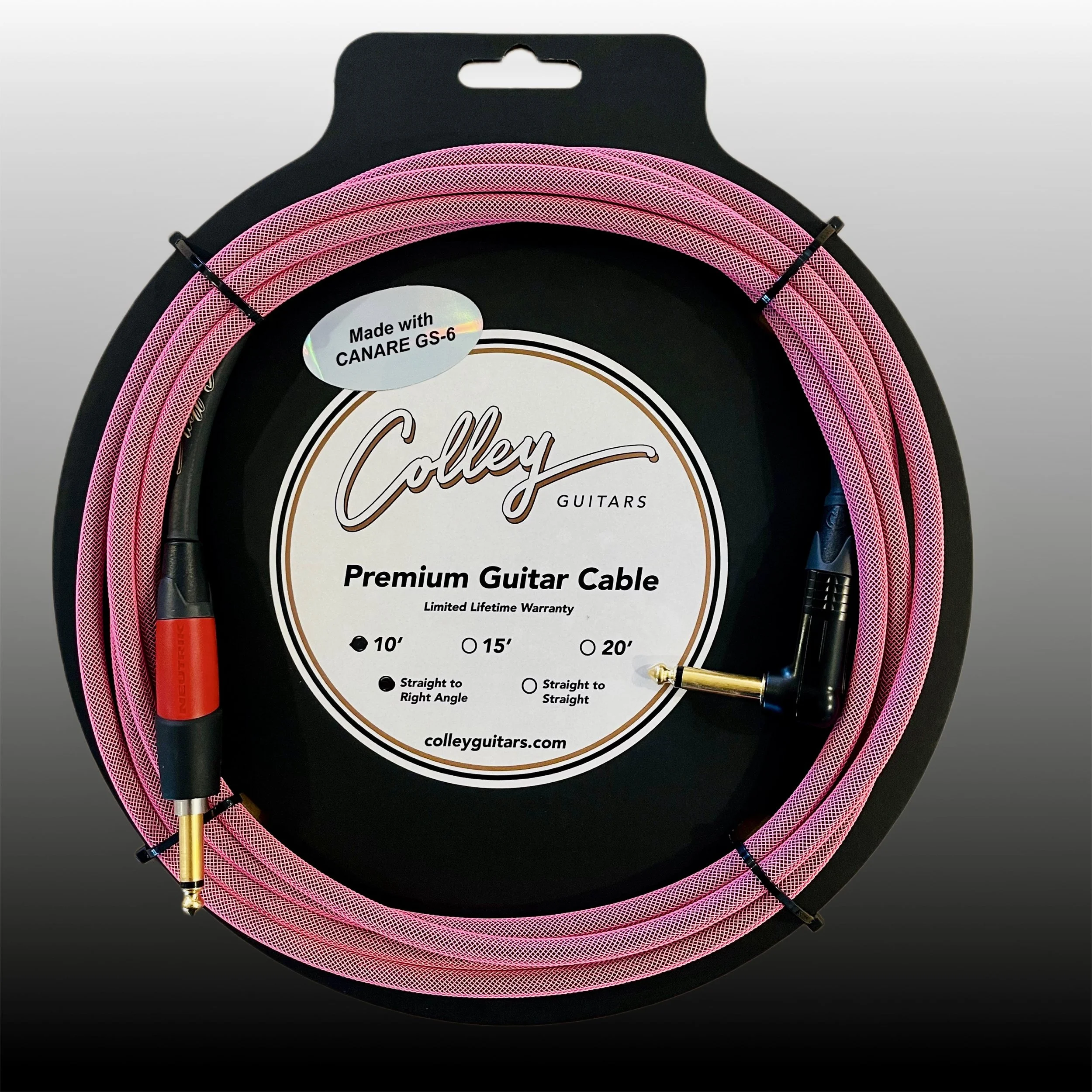 Pink guitar cable coiled around a black circular display with a label reading 'Colley Guitars Premium Guitar Cable' and specifications for different lengths and angles.