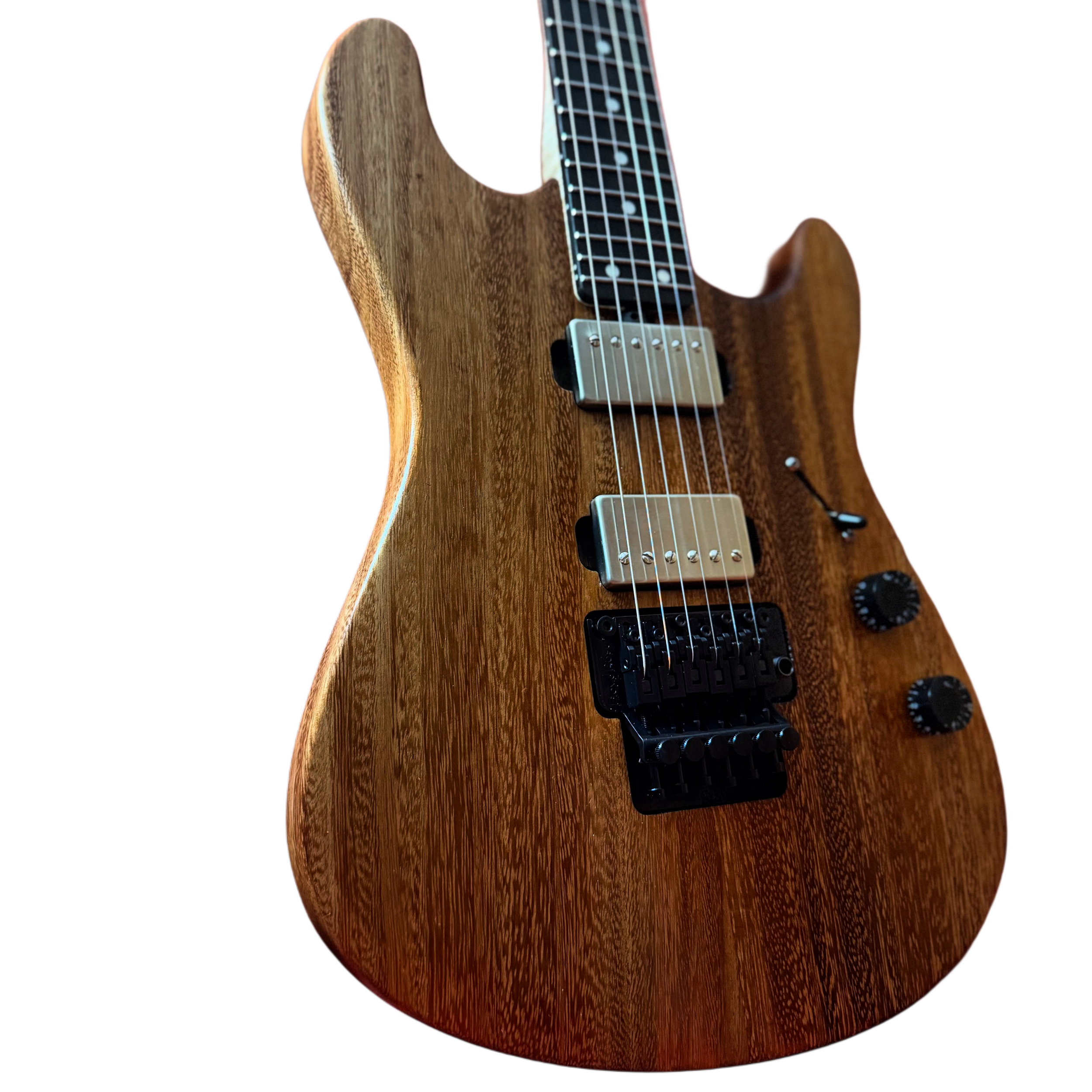 A wooden electric guitar with a natural wood finish, six strings, two humbucker pickups, and control knobs.