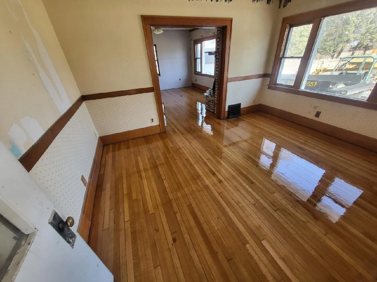 The after photo of a hardwood pine floor refinished by Fourth Gen Flooring in Solon iowa.