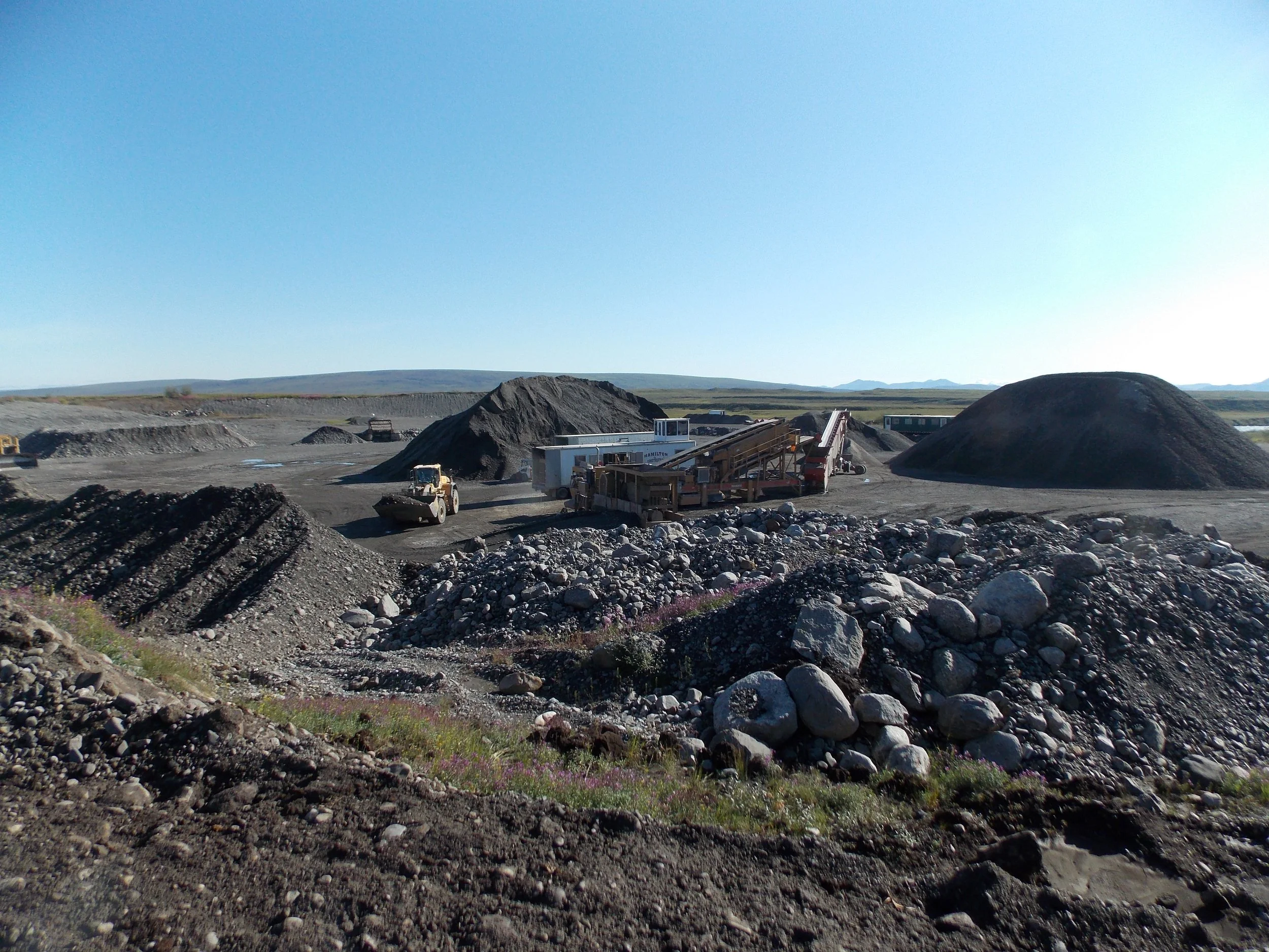 Construction site with rocks and machinery