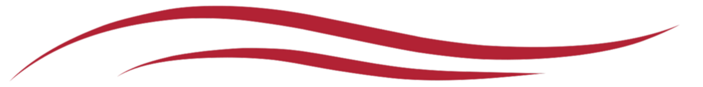 Close-up of red painted wooden surface with smooth curved lines.