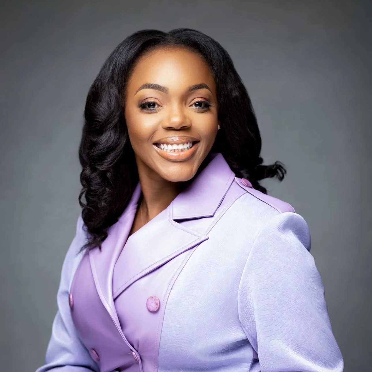 A woman smiling, wearing a light purple blazer with a textured pattern and matching lapels, against a grey background. Nadine Niba, Treasurer

Risk Advisory Services Leader, BDO