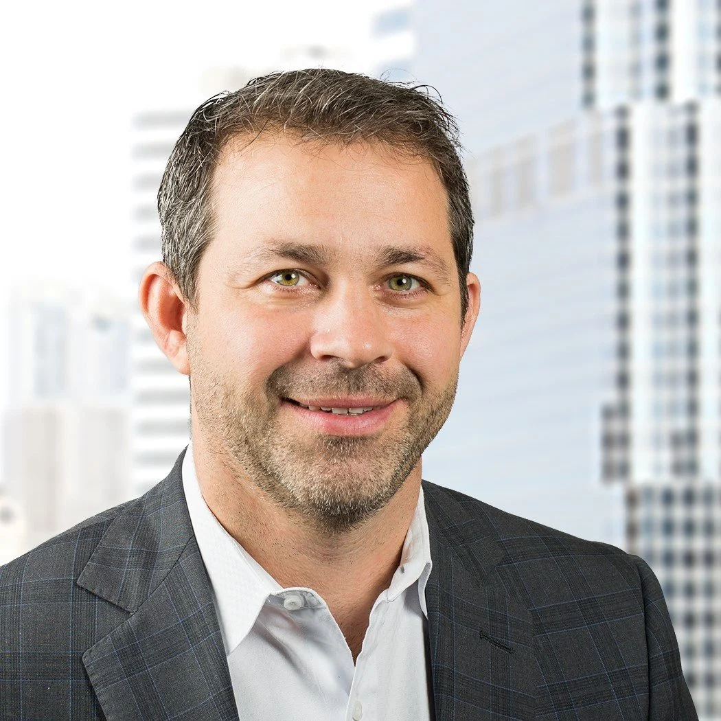 Headshot of a smiling man in a suit, with city buildings in the background. Sean Hennessy

Partner, SAP Practice, Deloitte Canada