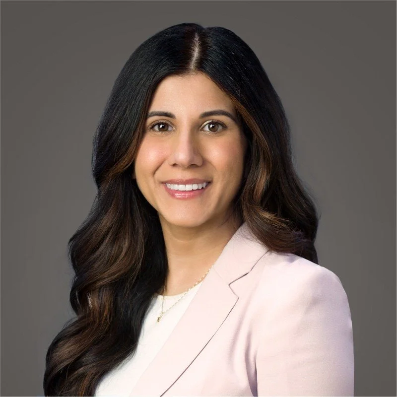 A woman with long dark hair smiling in a studio portrait against a gray background, wearing a light pink blazer and white top. Nafeesa Kassam

VP Finance, Liquids Pipelines, Enbridge