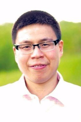 JA (Junior Achievement) Southern Alberta student standing outdoors with a green landscape in the background