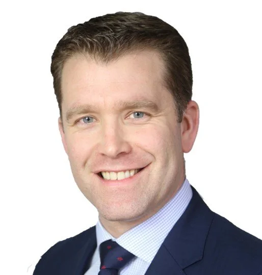 Headshot of a smiling man with light brown hair, wearing a navy suit, light blue shirt, and dark tie, against a white background. Fraser Stenhouse

Managing Director, Communications Media & Technology, Accenture