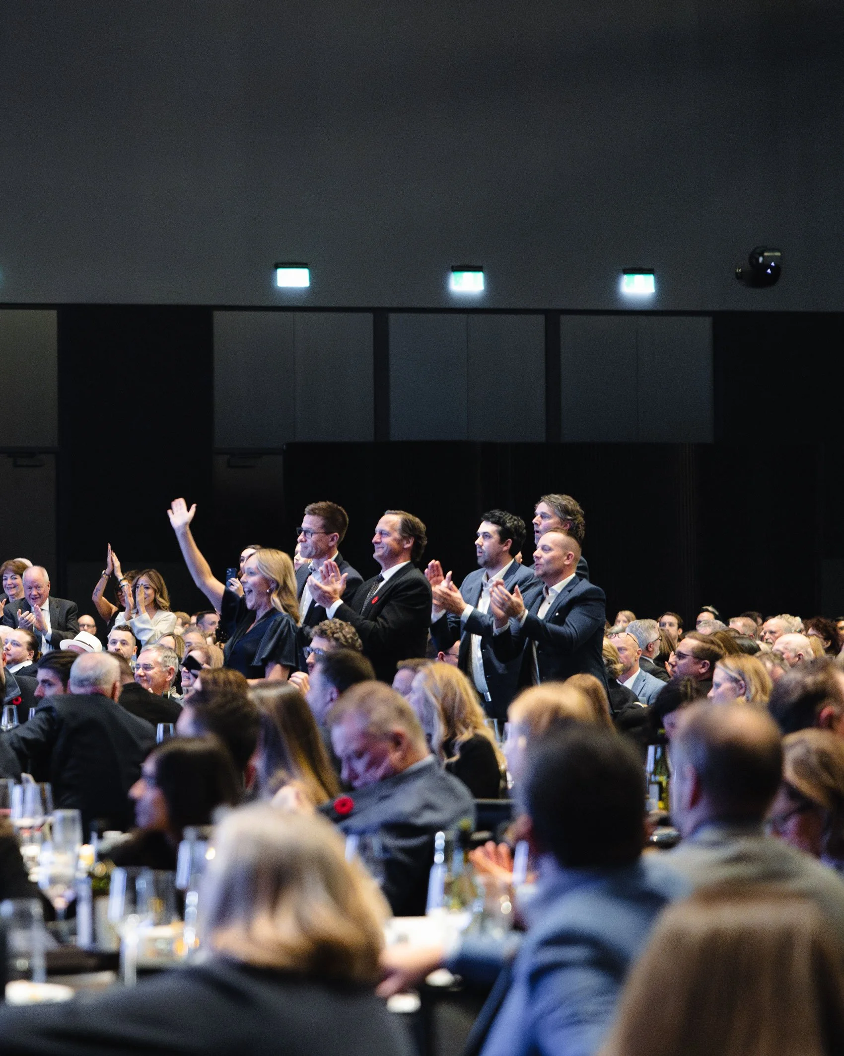 Audience applauding during a JA (Junior Achievement) Southern Alberta event in a conference setting