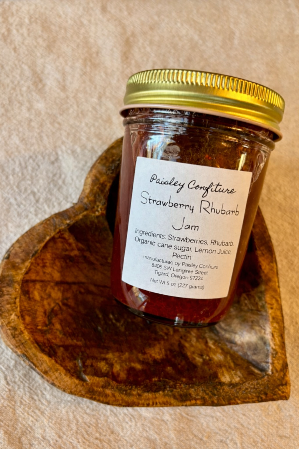 Strawberry rhubarb jam in heart bowl.png