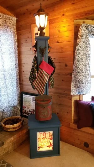 Stand along Christmas stocking holder with Santa mail box and lighted post and lighted box