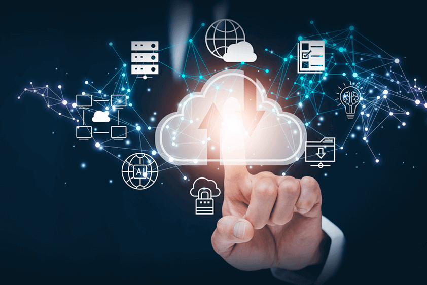 A person in a suit pointing at a digital cloud surrounded by icons representing data storage, AI, security, connectivity, and cloud computing on a dark background.