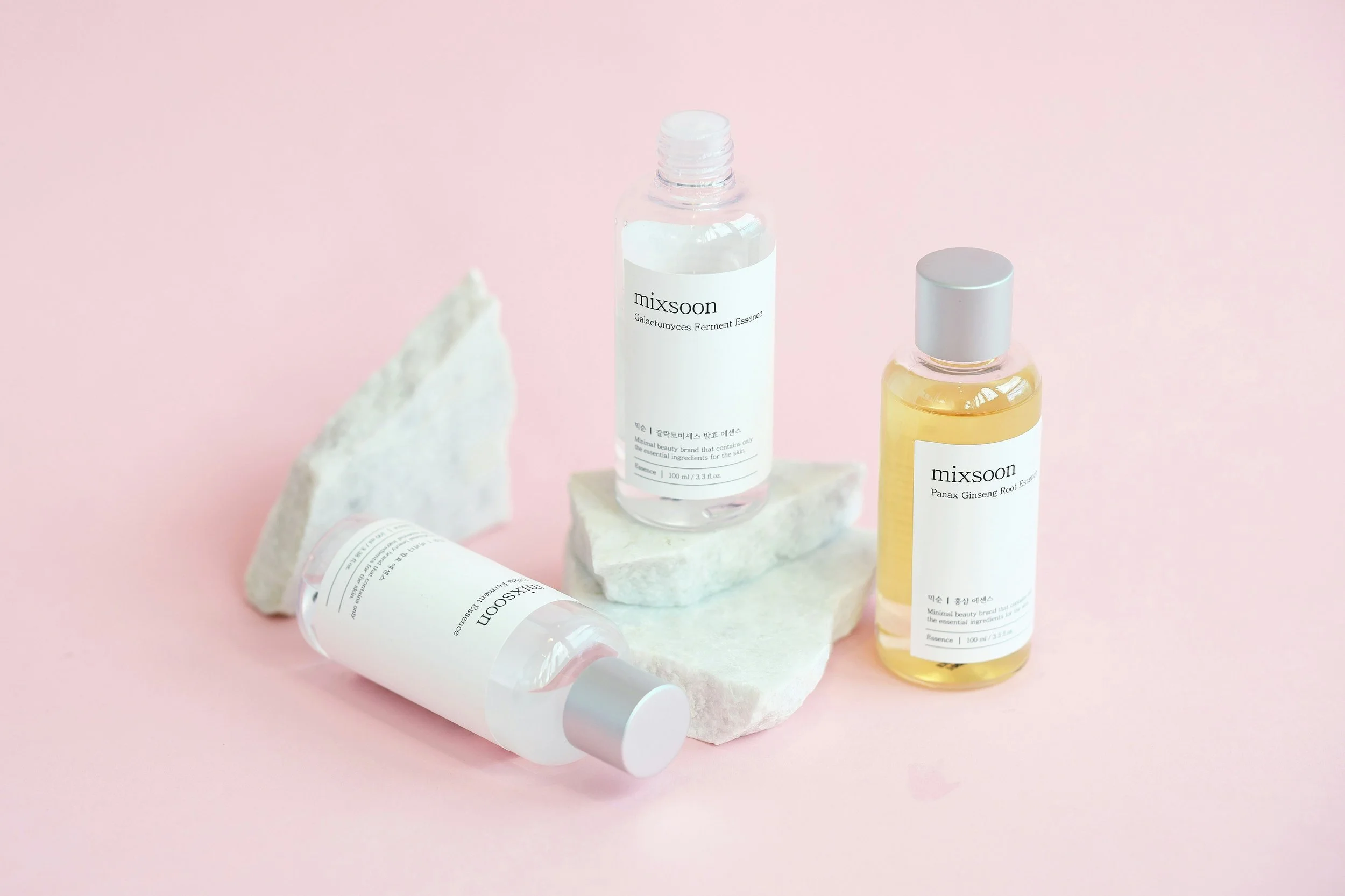 Outdoor dining table decorated with floral arrangements and candles, string lights hanging above, set in a garden or backyard.