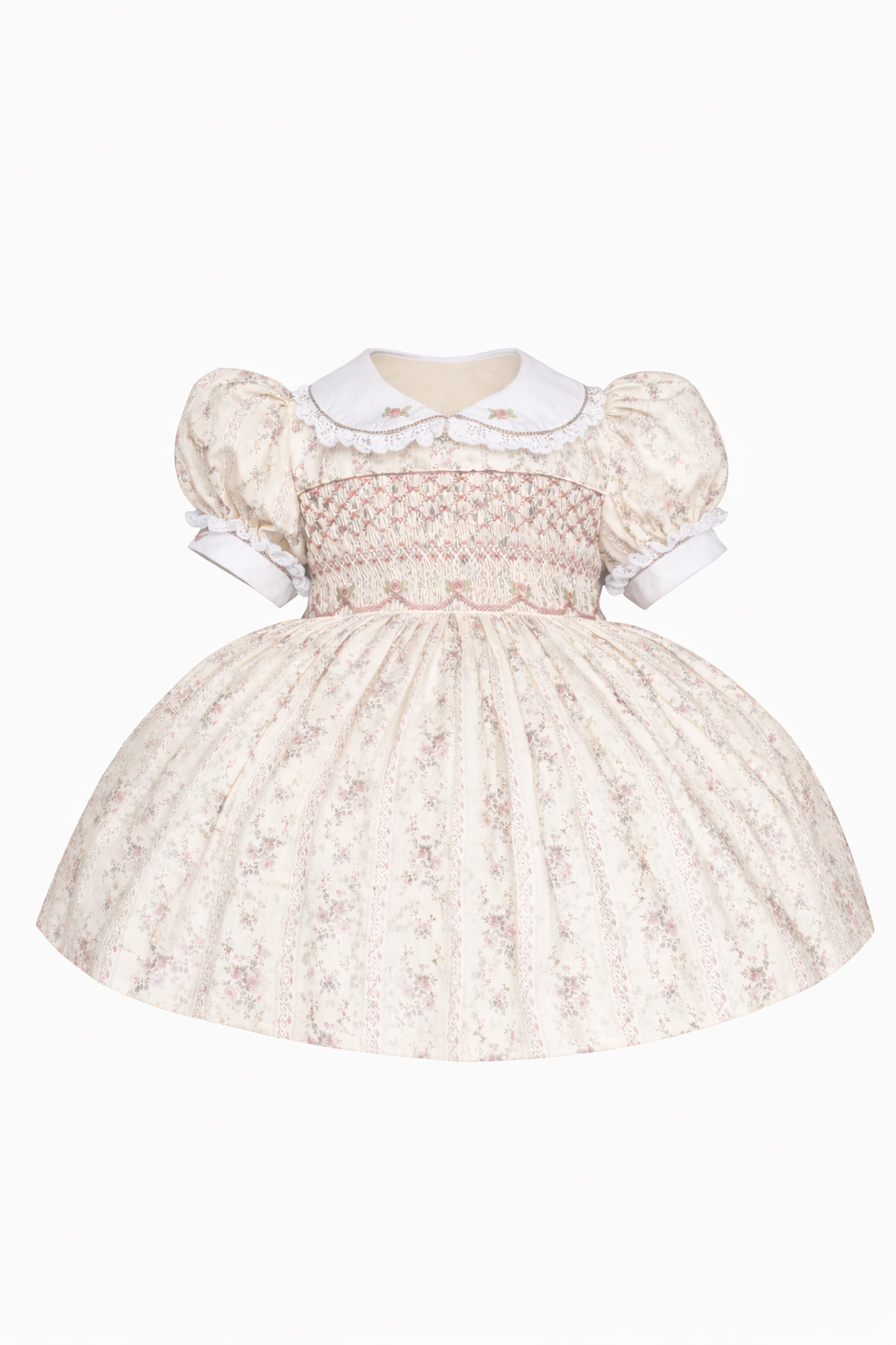 Vintage child's dress with puffed sleeves, embroidered smocking, and floral details, featuring a full skirt.
