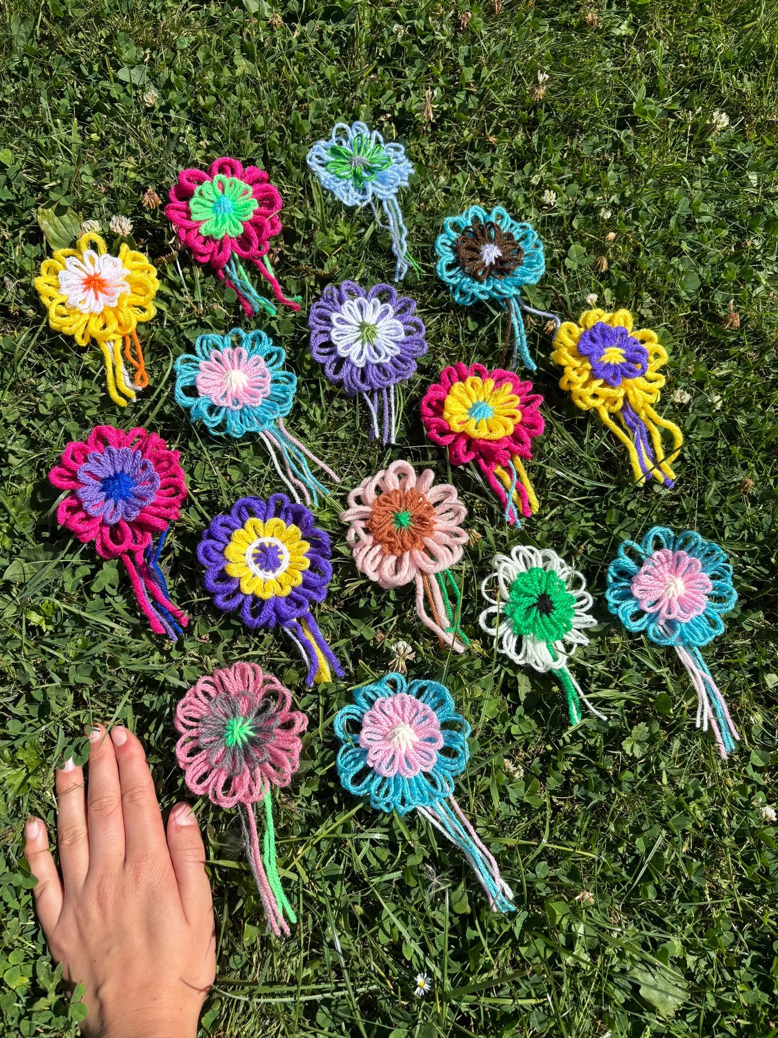 Pride flag rosettes hand.jpeg