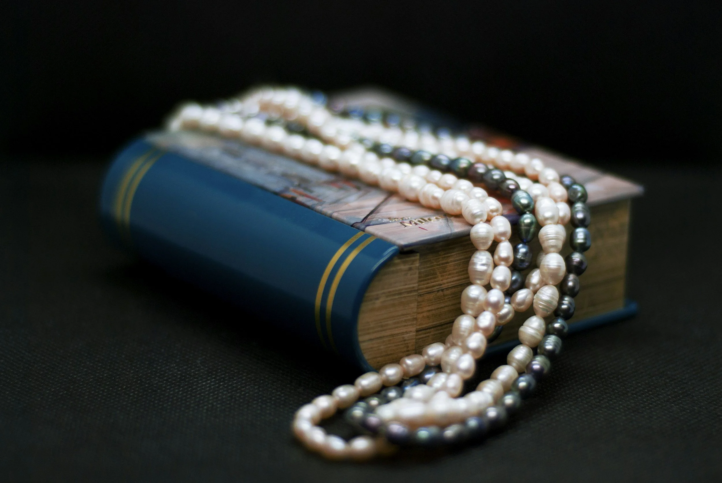 string of pearls on a book