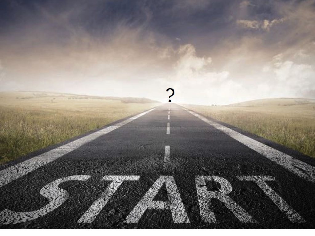 An open road extending towards the horizon with a cloudy sky and a question mark in the distance.
