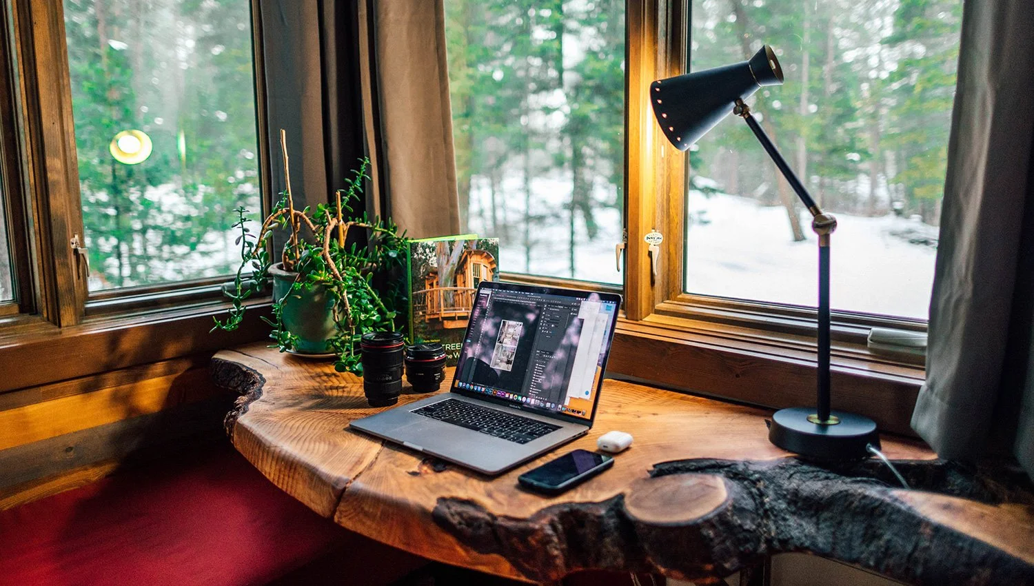 home office looking out to woods in winter