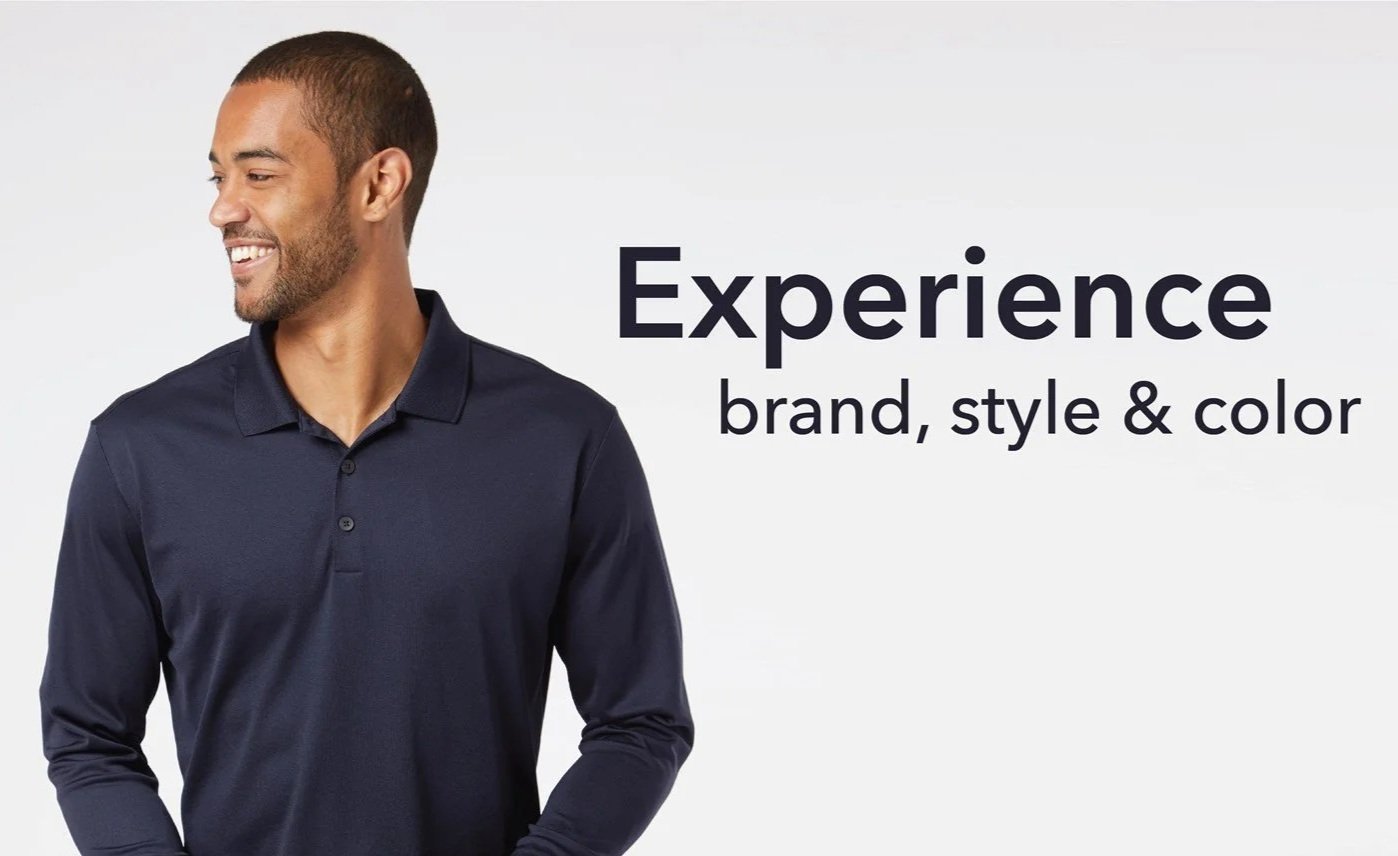 Smiling man in navy blue polo shirt standing next to text that reads 'Experience brand, style & color' against a light background.