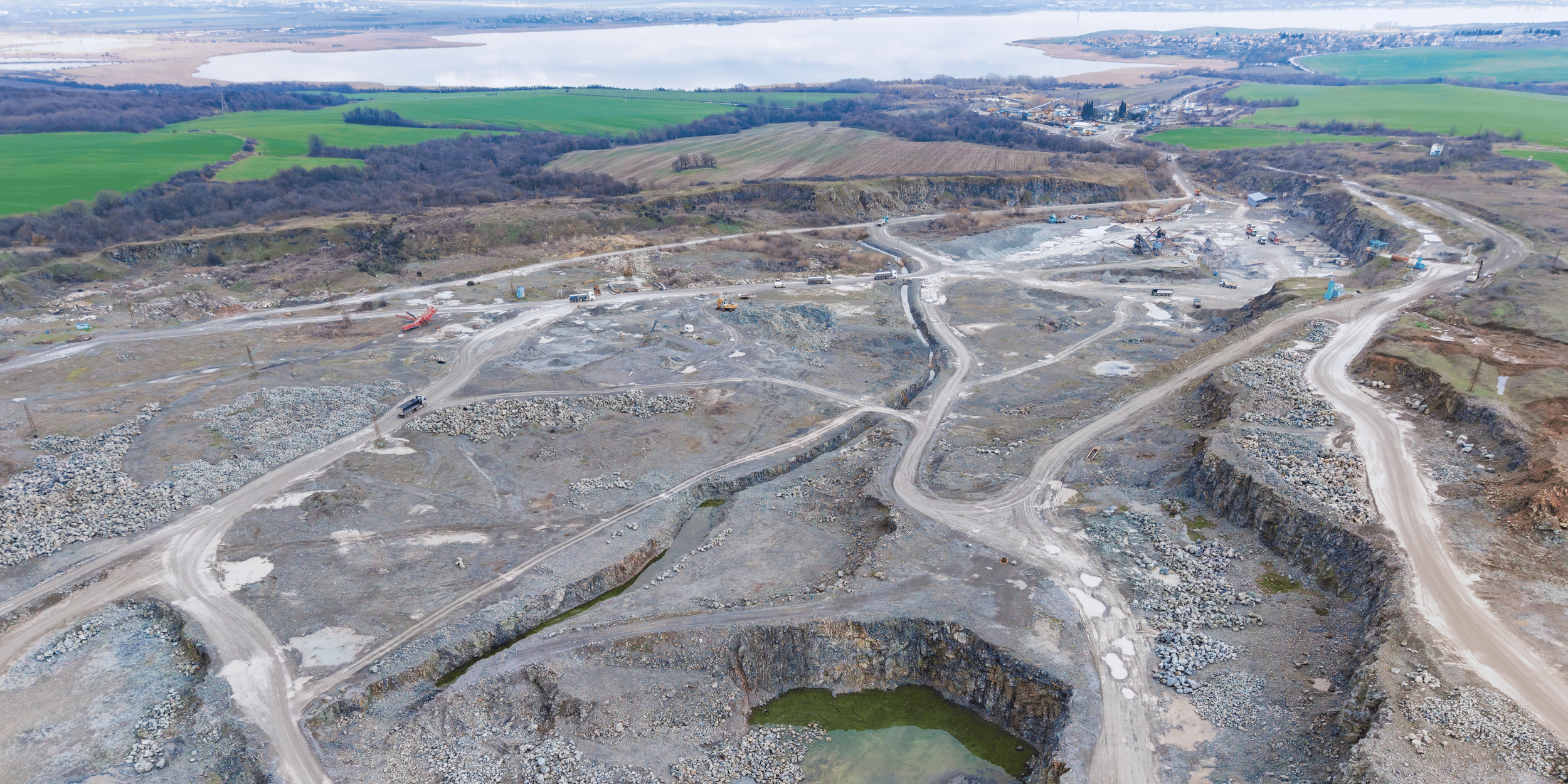 Aerial view of contaminated or disturbed land showing excavation, site assessment, and environmental remediation for redevelopment projects