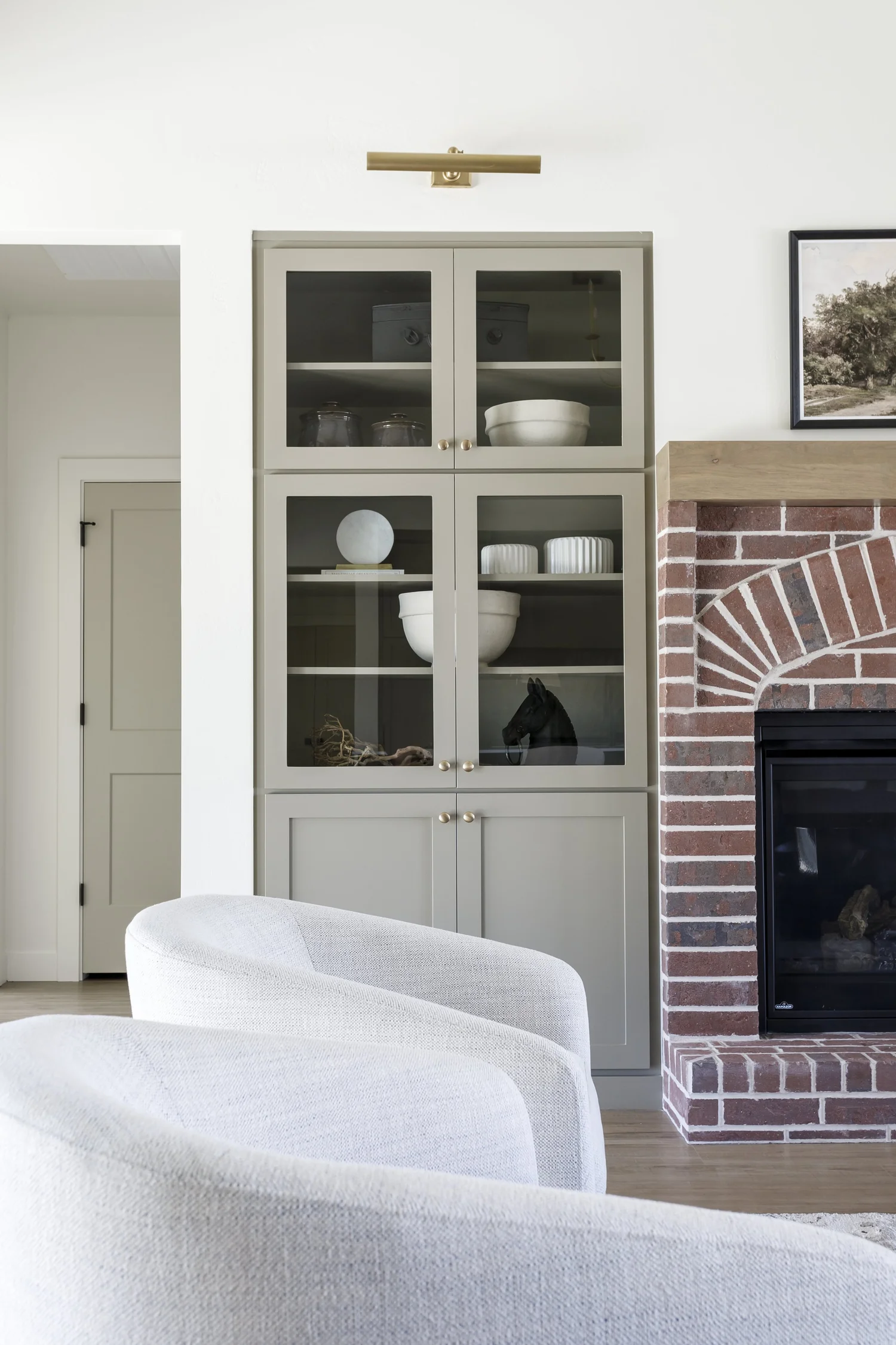 Brick fireplace with sage built-ins, interior photograph 3 of 5 by Andi Marshall Interiors
