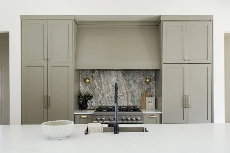 Brick fireplace with sage built-ins