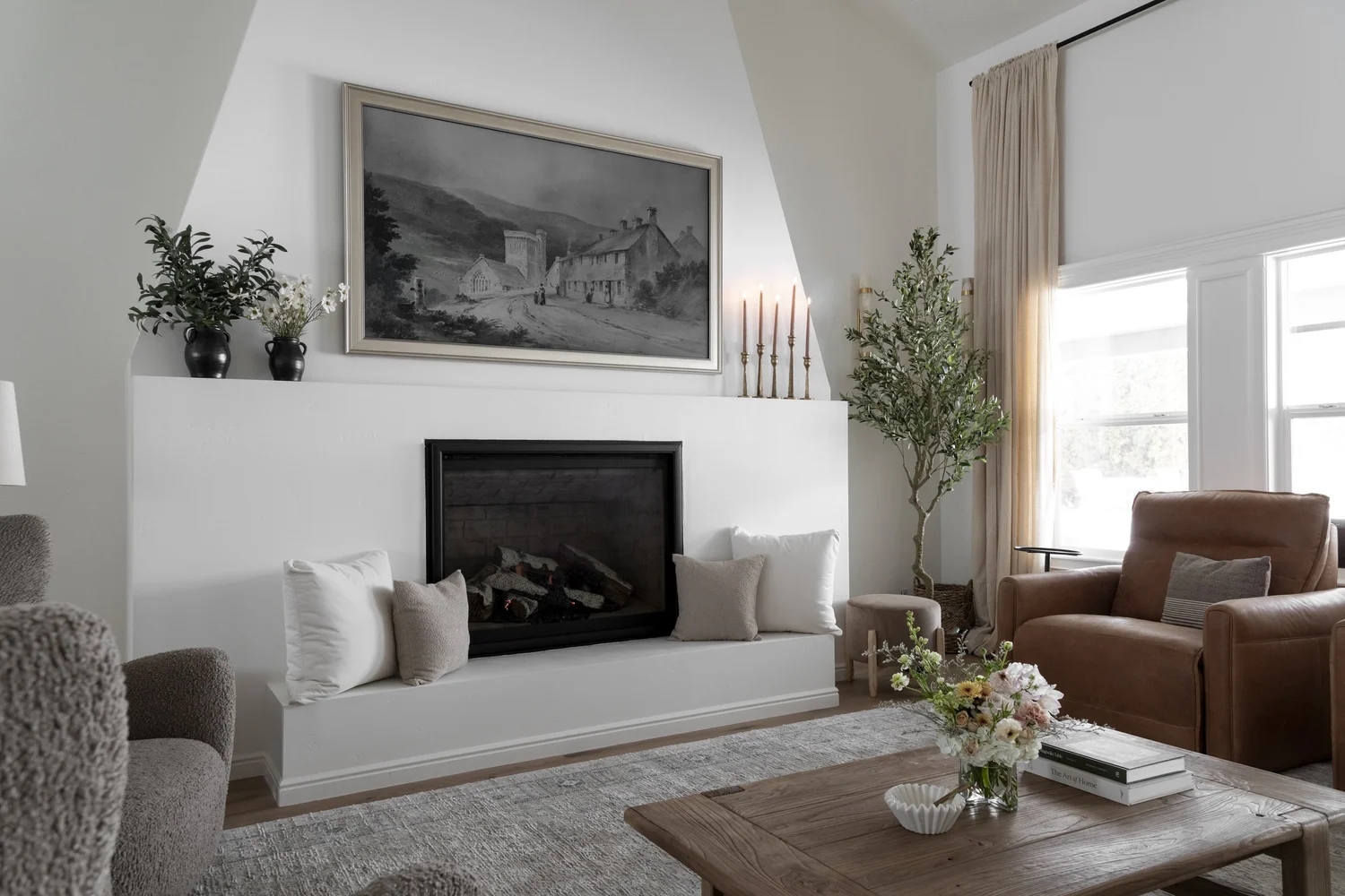 white fireplace, leather chair, sofa, coffee table