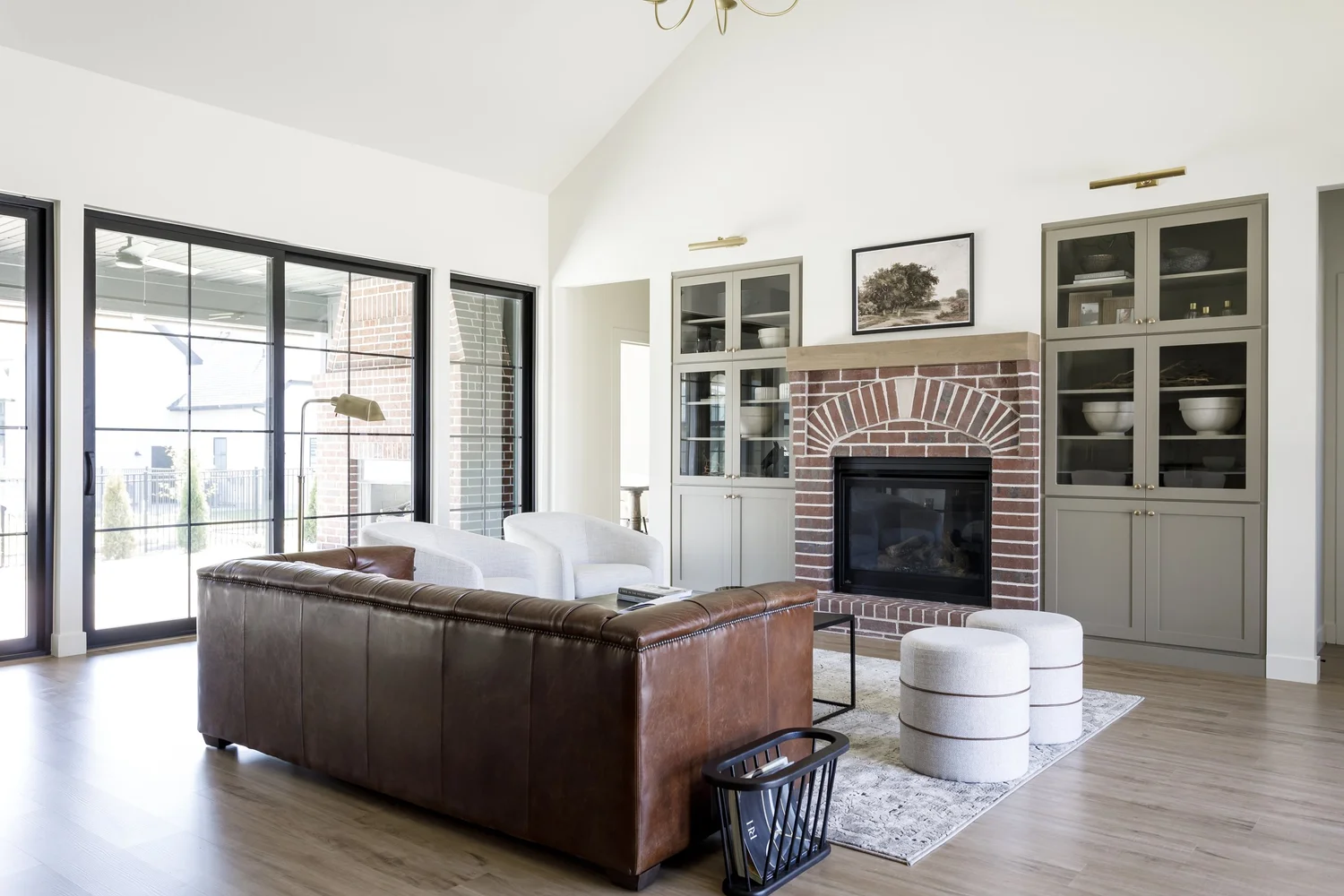 Brick fireplace with sage built-ins, interior photograph 2 of 5 by Andi Marshall Interiors