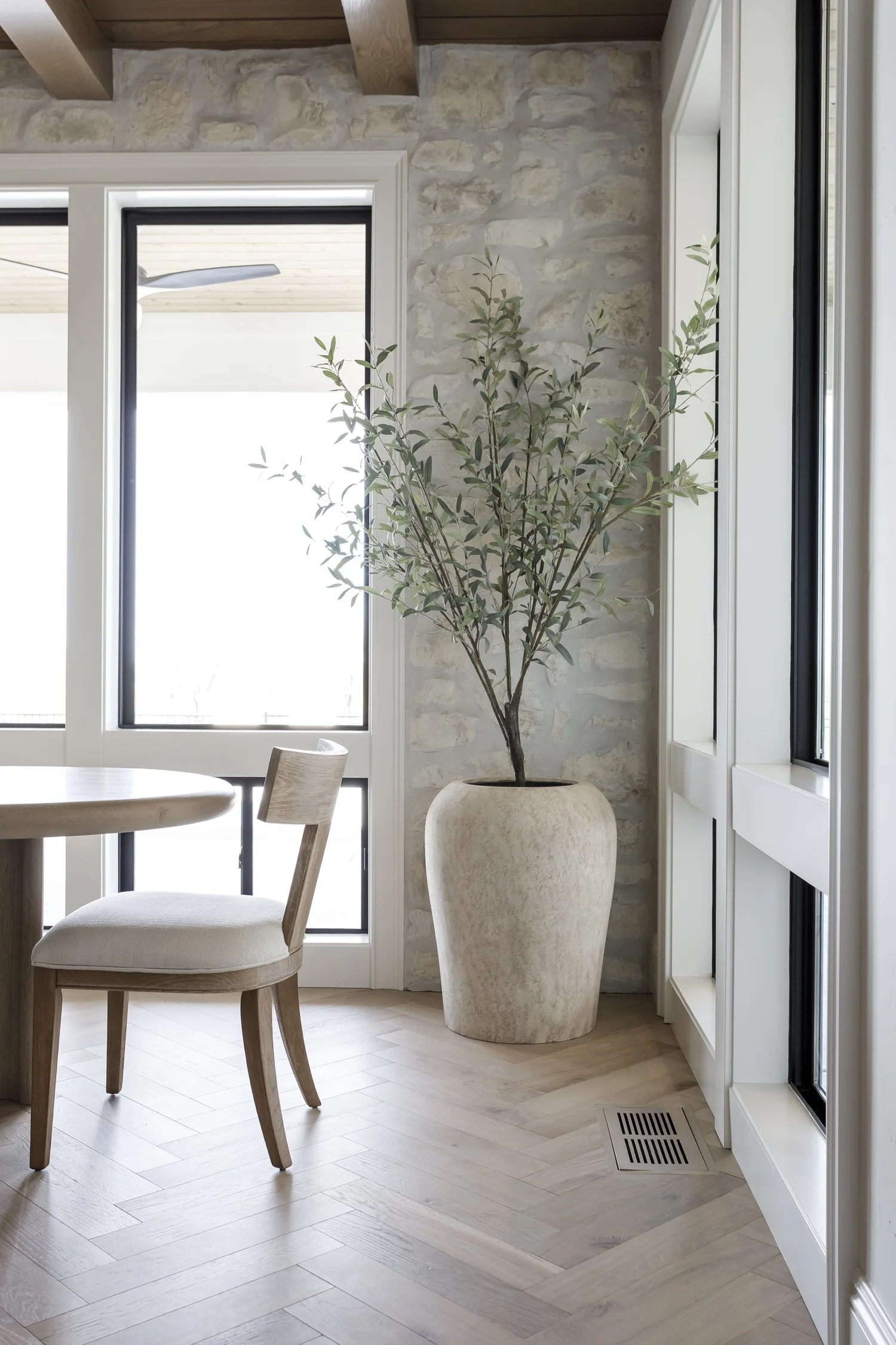 Herringbone floors, oak island and stone fireplace, interior photograph 9 of 12 by Andi Marshall Interiors