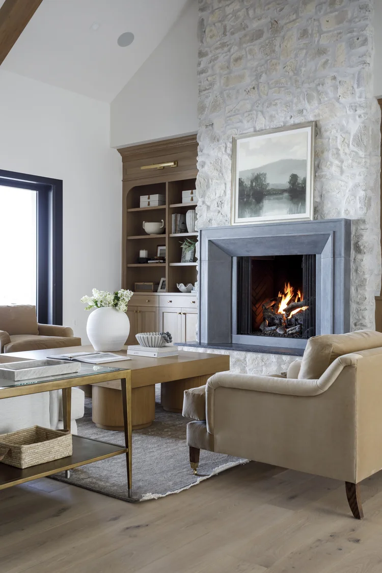 Herringbone floors, oak island and stone fireplace