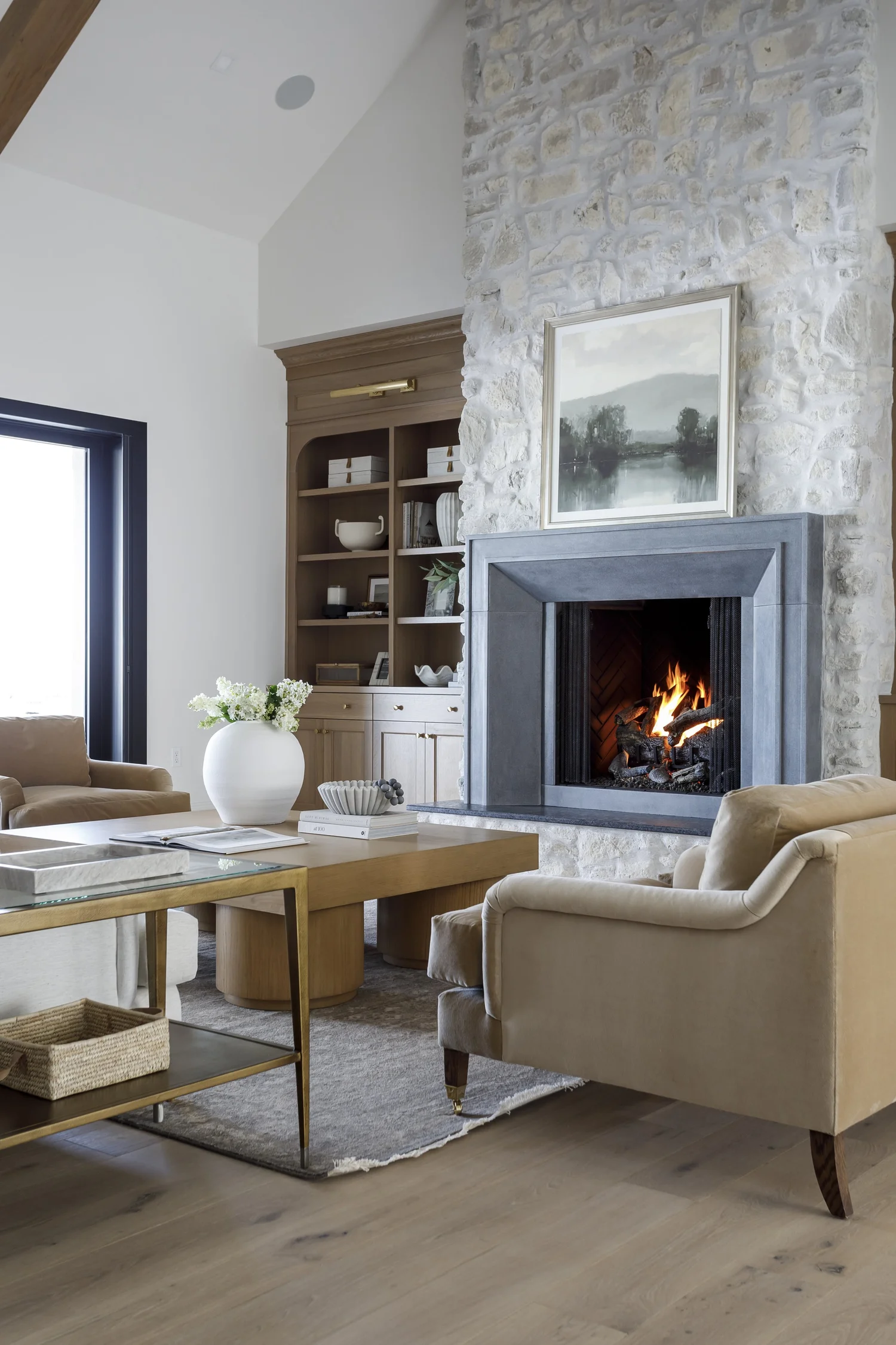 fireplace, built-ins, armchair, stone wall