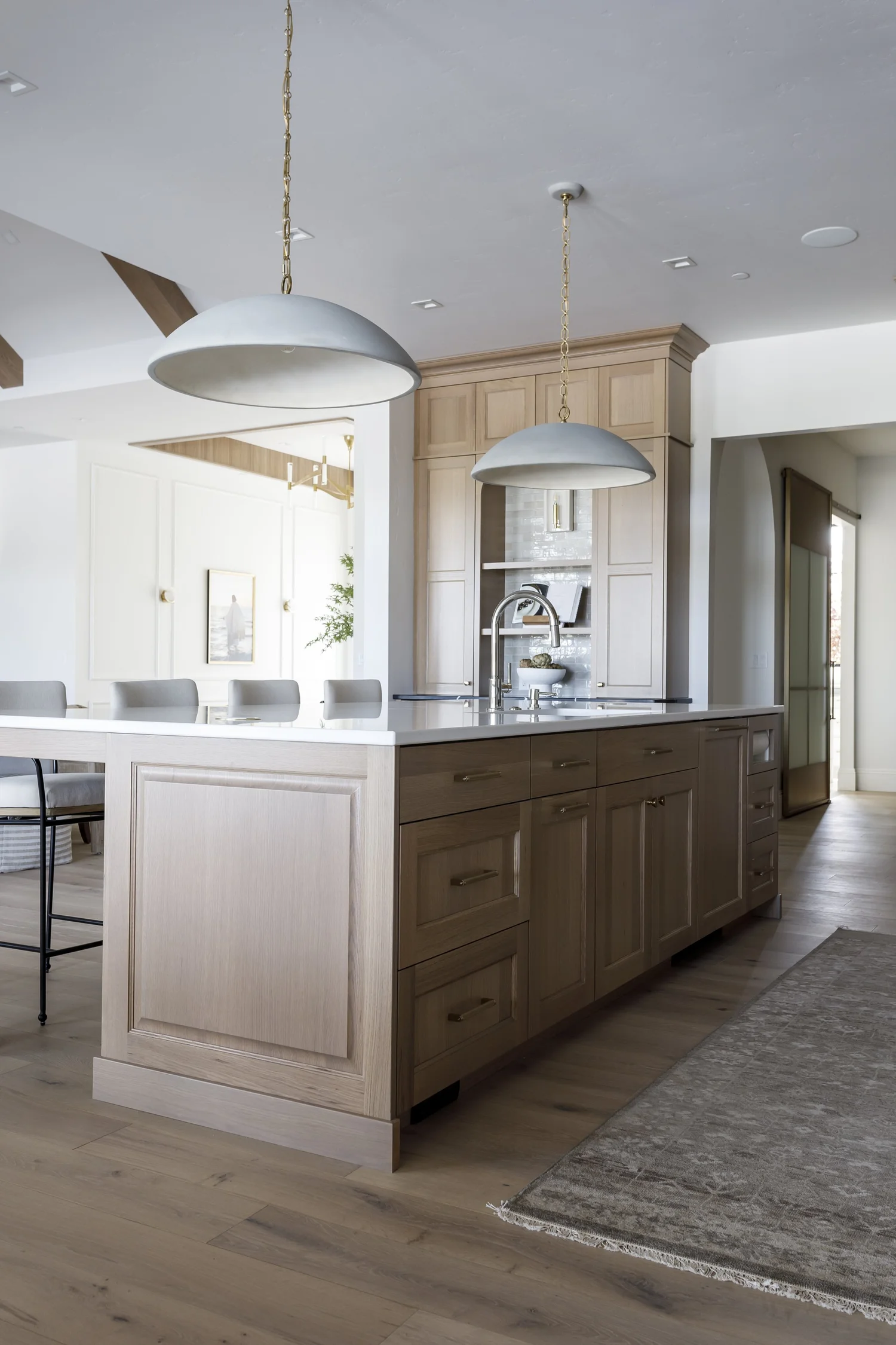 Herringbone floors, oak island and stone fireplace, interior photograph 11 of 12 by Andi Marshall Interiors