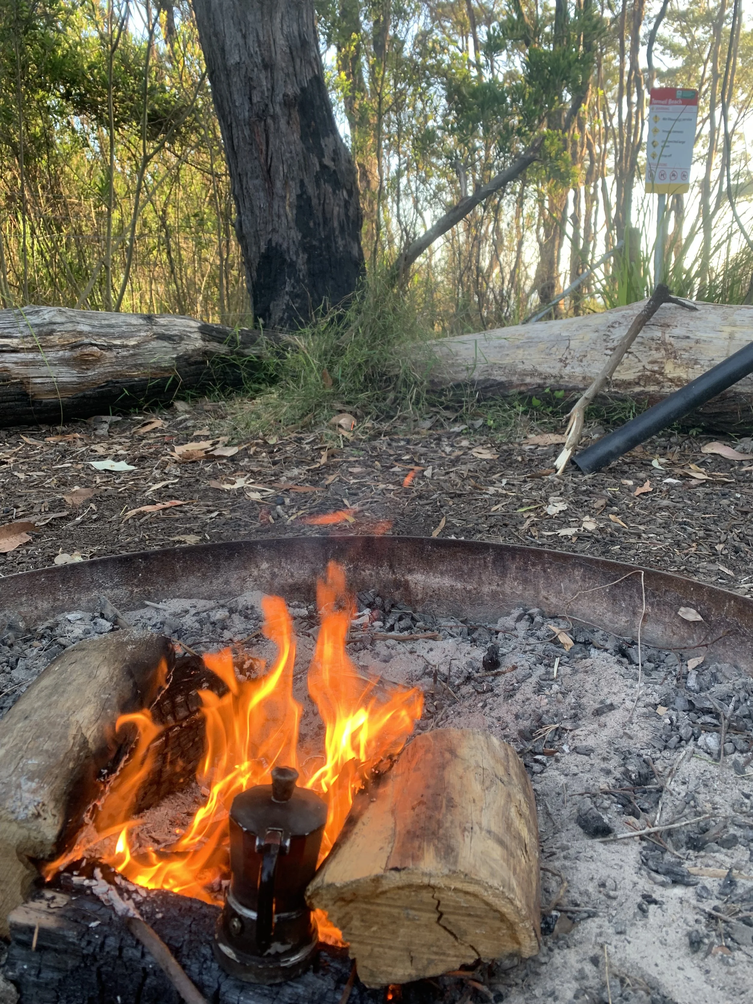 Campfire connections with community, small group gathered around a fire