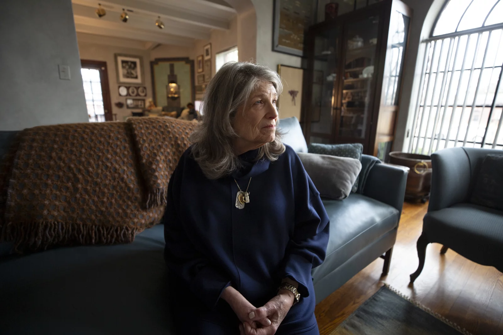 Carol Boigon seated at home in Denver