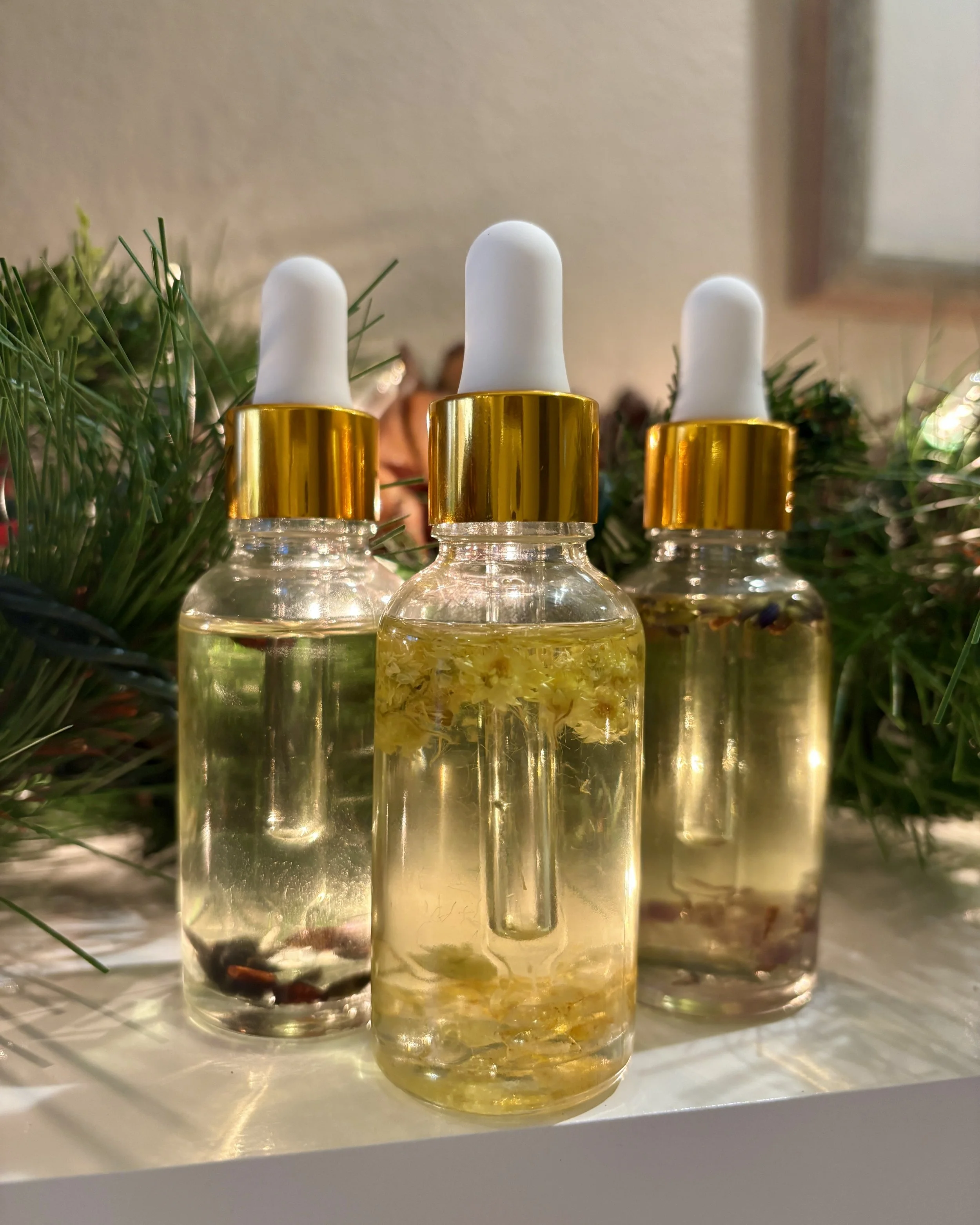 Glass dropper bottles filled with herbal oils and plant extracts