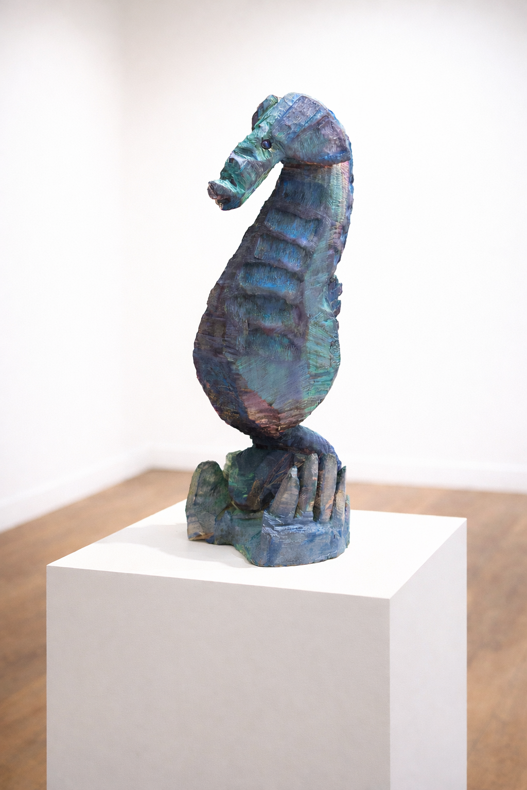 Iridescent seahorse sculpture in gallery.png