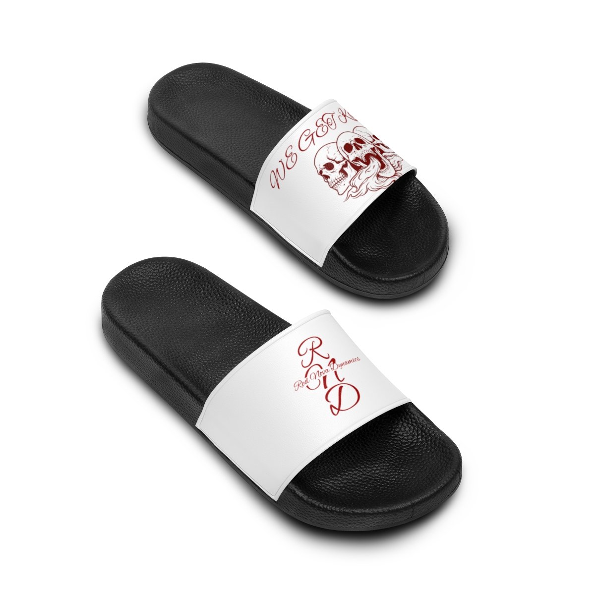 Pair of black and white slide sandals with gothic skull and text designs on the straps.