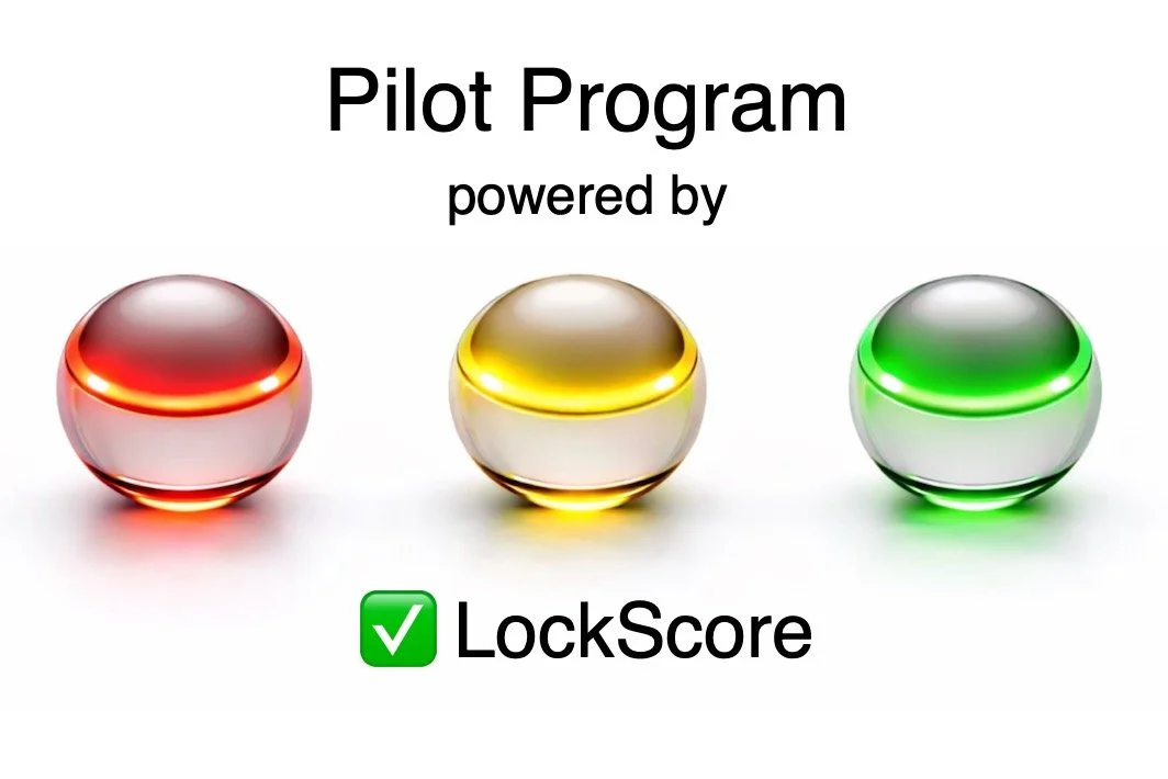 Graphic showing three shiny spheres with colored lights — red, yellow, and green — above text that reads 'Pilot Program powered by LockScore'.